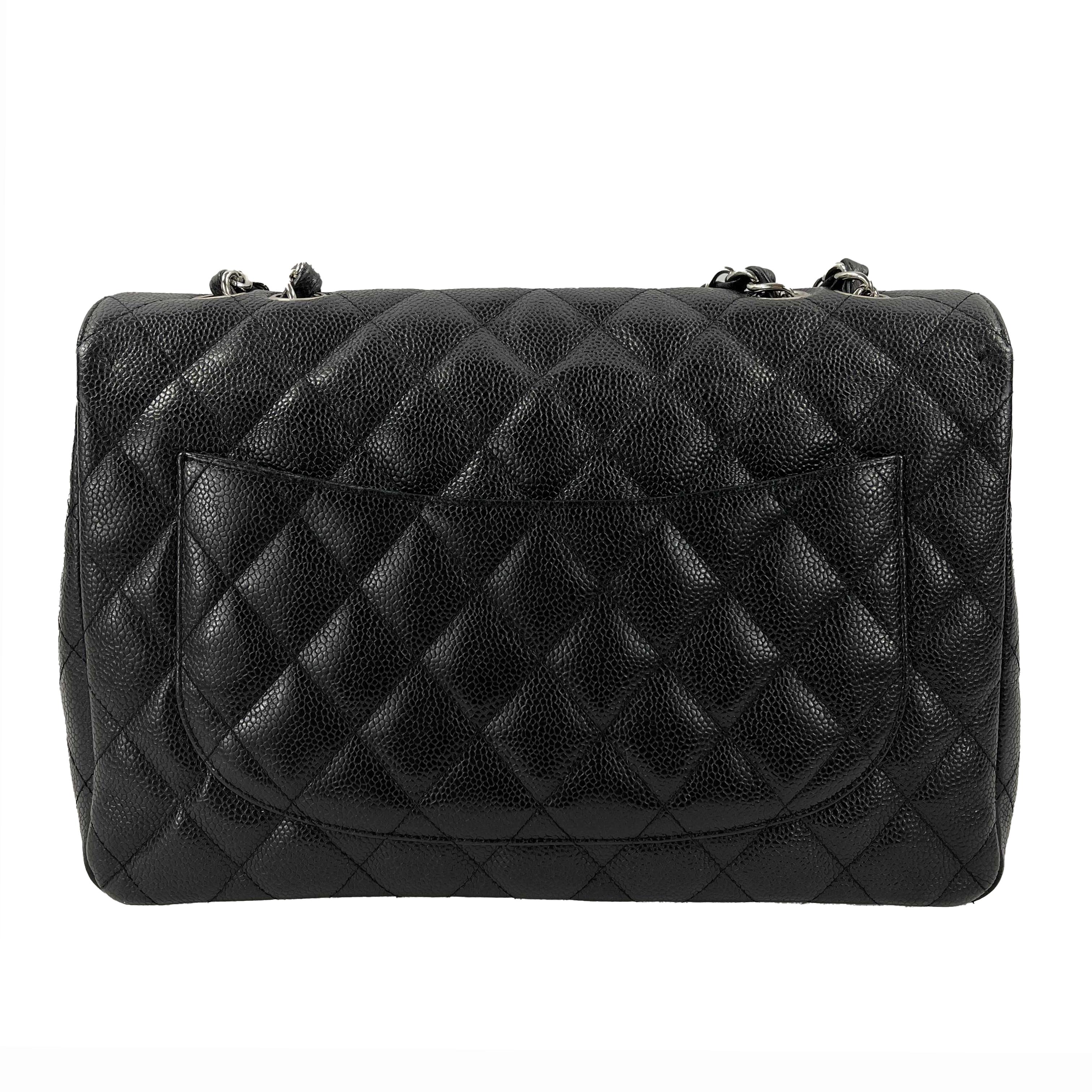 * This Chanel classic jumbo flap handbag is from the 2005 to 2006 collection.
* It's crafted black caviar quilted stitched leather and silver-toned hardware.
* The bags opens using a CC turn-lock to a compartment lined in black smooth leather with a
