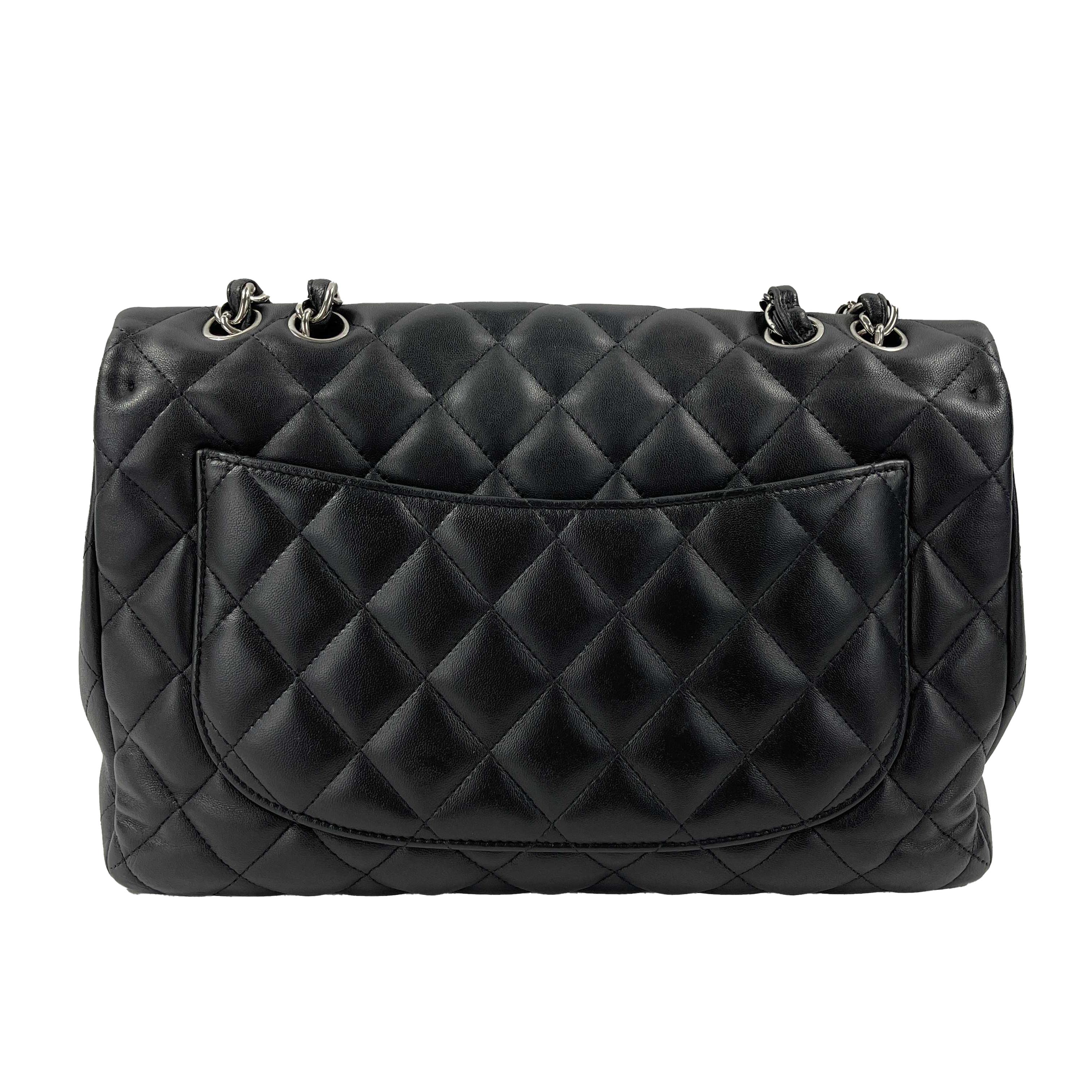 escription

* 2008-2009 Collection era.
* This classic flap bag features soft lambskin leather in black with the classic Chanel diamond quilt pattern.
* One main interior compartment with one slip pocket and one zip pocket.
* Slip pocket on back.
*