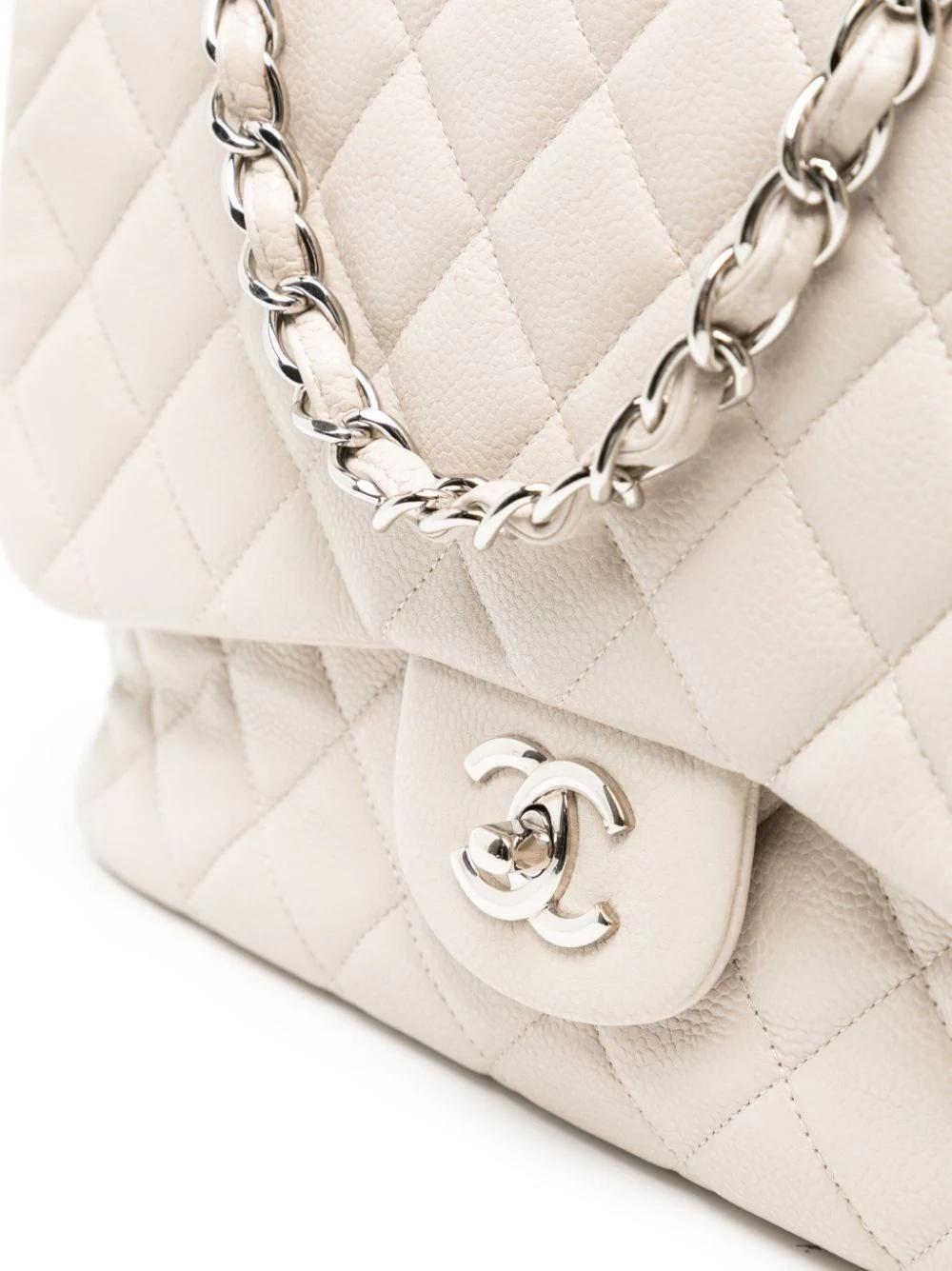 * Crafted in 2011
* White
* Caviar leather
* Diamond quilting
* Leather and chain-link shoulder strap
* Single Flap
* Front flap closure
* Signature interlocking CC turn-lock fastening
* Main compartment
* Internal slip pocket
* Internal