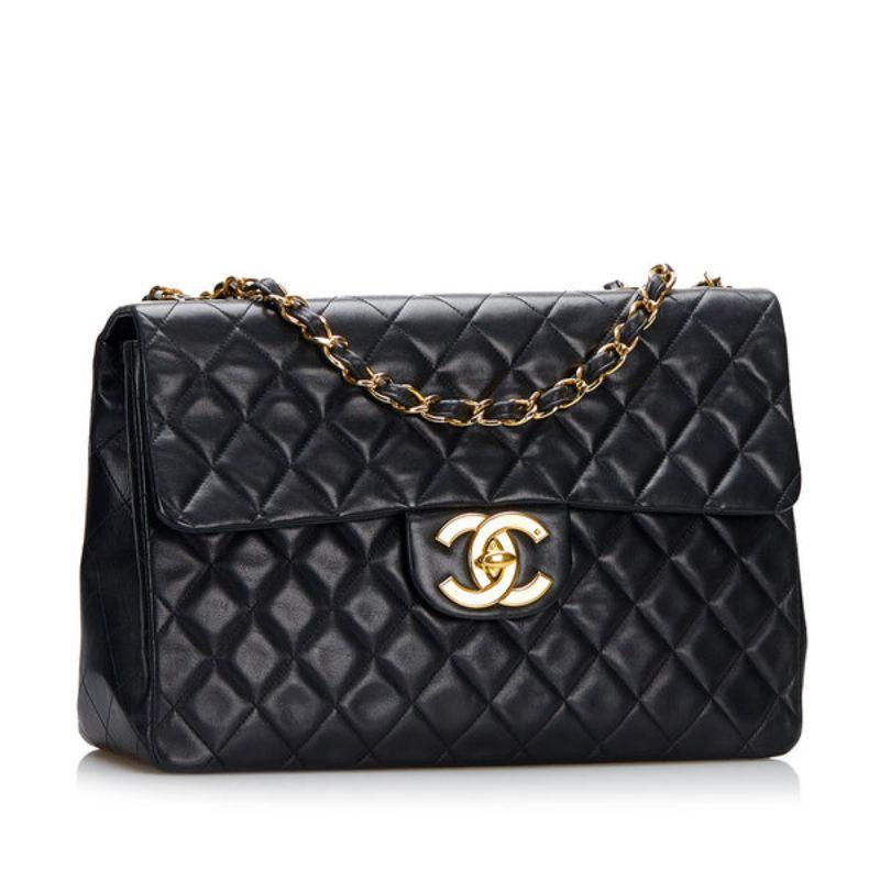 Chanel Jumbo Classic Lambskin Double Flap Shoulder Bag

This shoulder bag features a quilted lambskin leather body, an exterior back slip pocket, leather-woven chain straps, double front flaps with CC turnlock closure, and interior slip