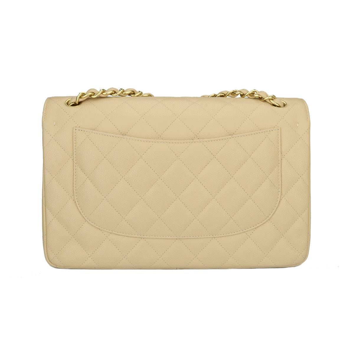 Authentic CHANEL Classic Jumbo Double Flap Beige Clair Caviar with Gold Hardware 2012.

This stunning bag is in mint-pristine condition, the bag still holds its original shape, and the hardware is still very shiny

Exterior Condition: Pristine