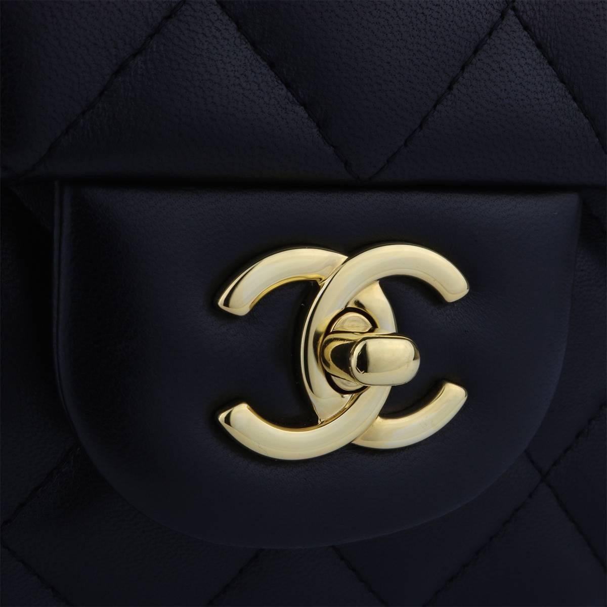 Authentic CHANEL Classic Jumbo Double Flap Black Lambskin with Gold Hardware 2015.

This stunning bag is in a mint condition, the bag still holds its original shape, and the hardware is still very shiny. Leather smells fresh as if new.

Exterior