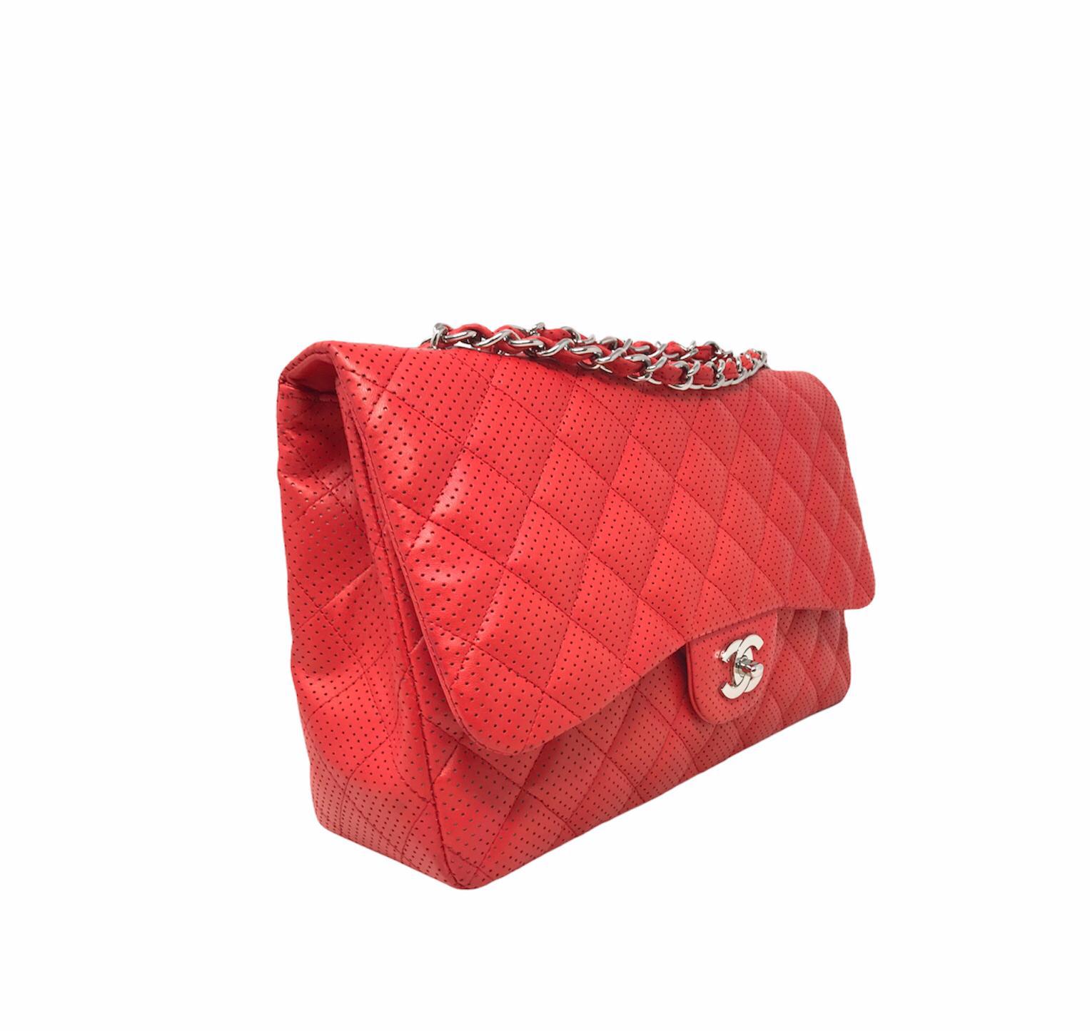 Chanel Jumbo Model Limited Edition bag in Hdw coral red perforated leather and silver metal chain Excellent condition Year of production 2010 Not equipped with card, dust-Bag included dimensions 19.5 x 30 x 10 cm.