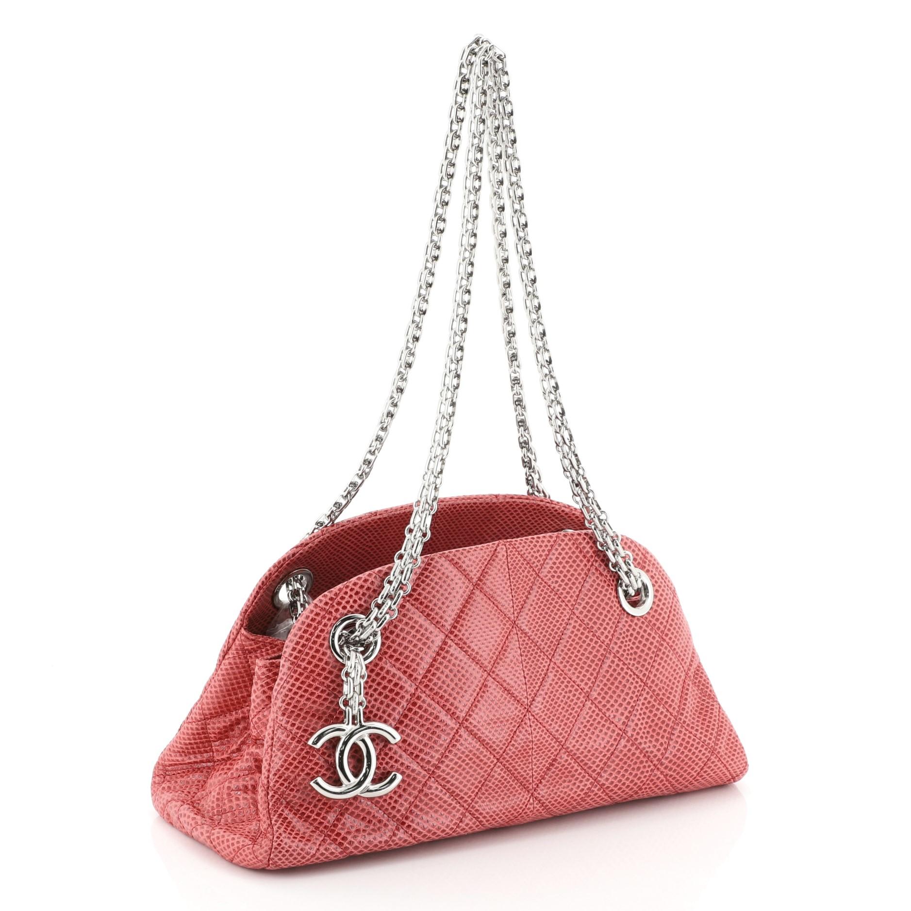 This Chanel Just Mademoiselle Bag Lizard Mini, crafted from genuine pink lizard, features reissue chain strap, interlocking CC logo charm and silver-tone hardware. It opens to a red leather interior. Hologram sticker reads: 14880238.  This item can