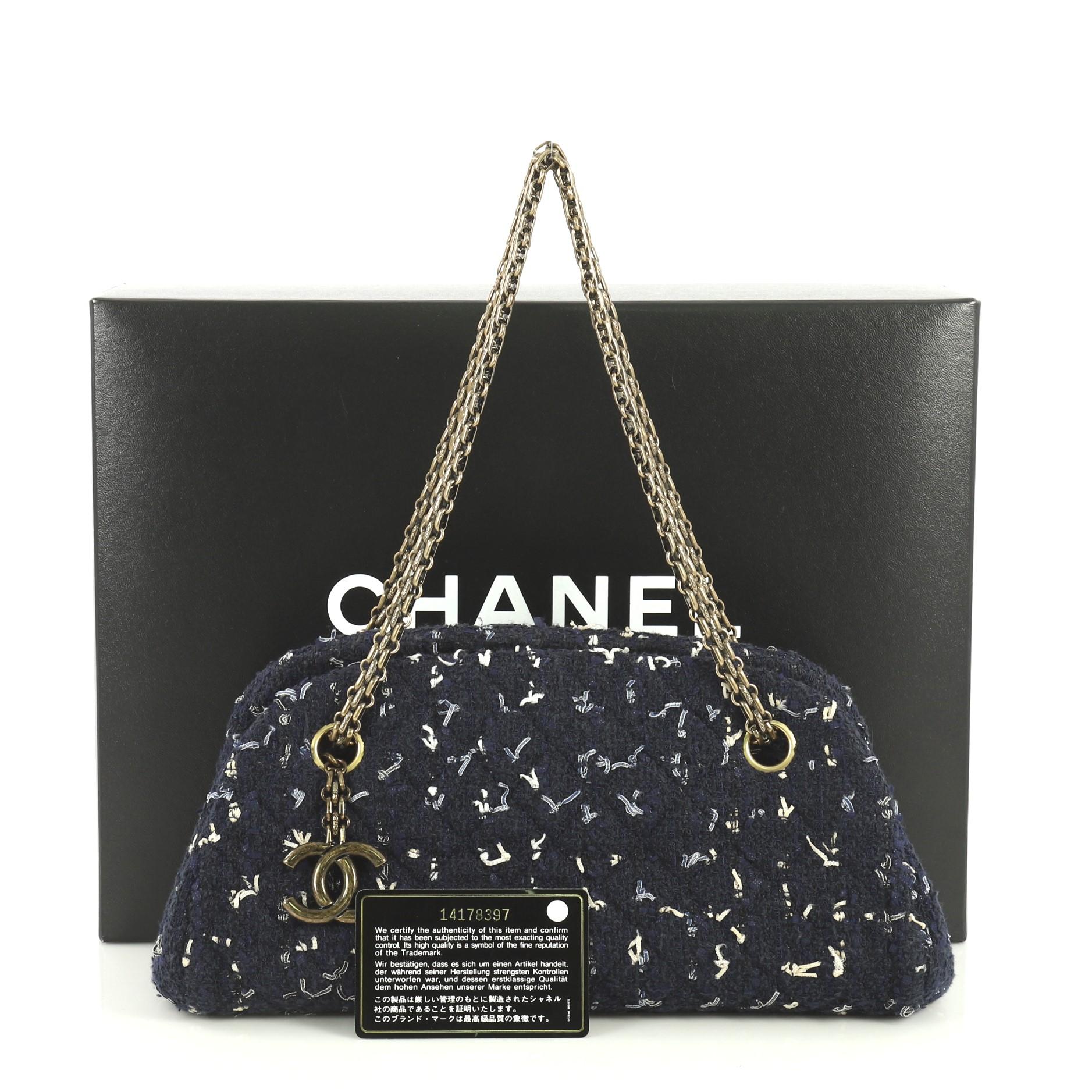 This Chanel Just Mademoiselle Bag Tweed Small, crafted from blue tweed, features gold-tone Chanel reissue chain, diamond stitch pattern, interlocking CC logo charm and aged gold-tone hardware. Its wide open top opens to a blue leather interior with