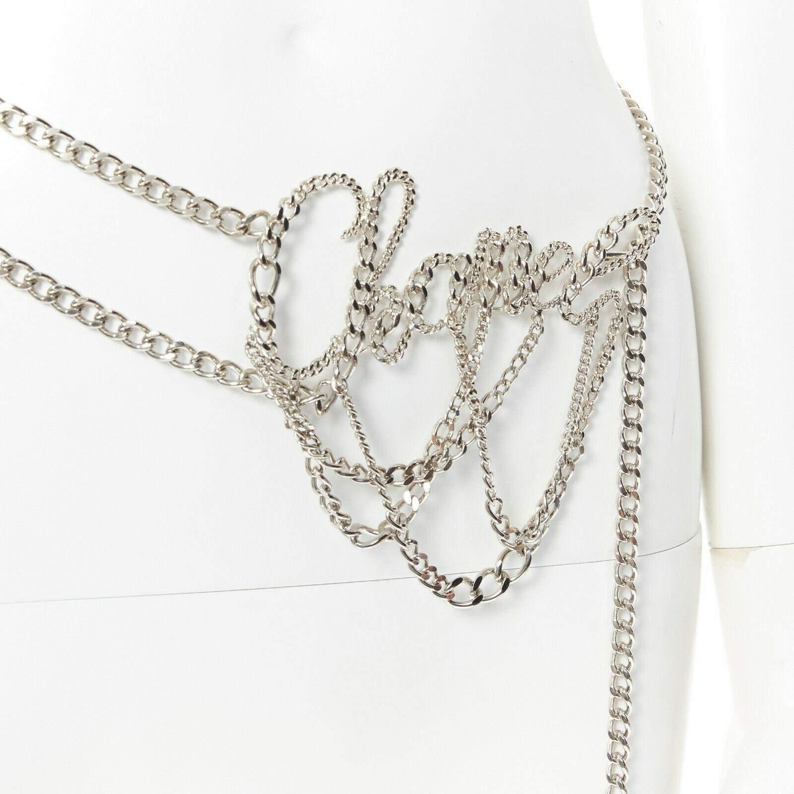 CHANEL KARL LAGERFELD 06P silver cursive logo draped chain punk belt necklace
Brand: CHANEL
Designer: Karl Lagerfeld
Collection: 06P
Model Name / Style: Chain belt
Material: Metal
Color: Silver
Pattern: Solid
Closure: Hook & Loop
Extra Detail: Heavy