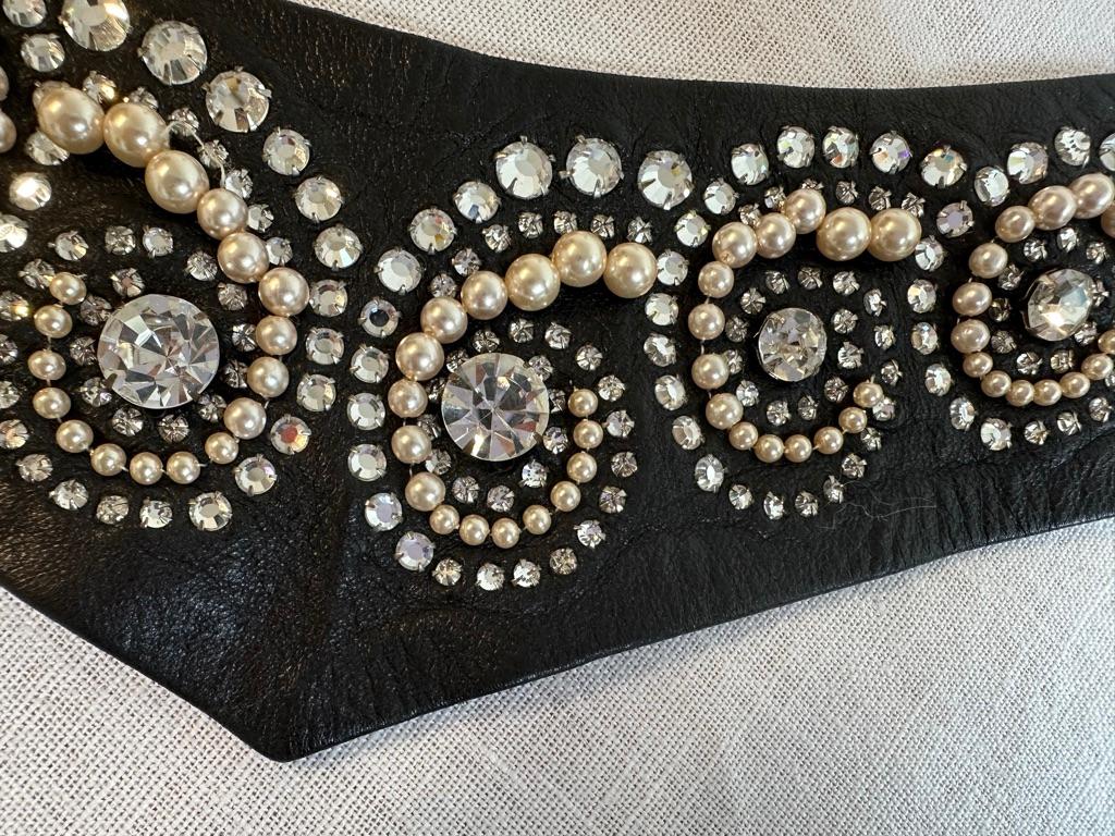 - CHANEL by Karl Lagerfeld
- Cira 2000
- Black lambskin leather
- Embellished with Rhinestones and Pearls 
- French size 40
- Made in France
- Sold by Mae Vintage London
