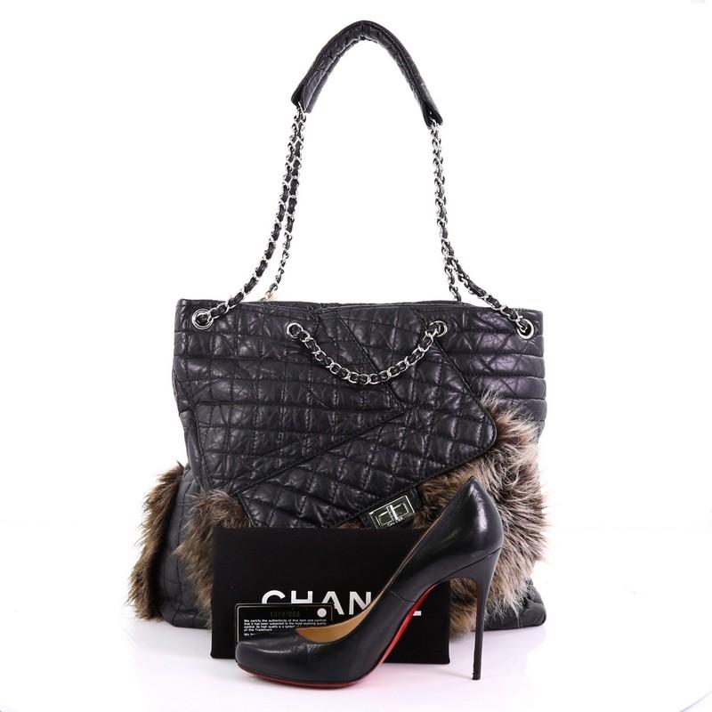 This Chanel Karl's Fantasy Cabas Tote Fur and Quilted Leather, crafted from black diamond quilted leather with extending brown genuine fur, features woven-in leather silver chain straps, an exterior front pocket with signature mademoiselle turn-lock