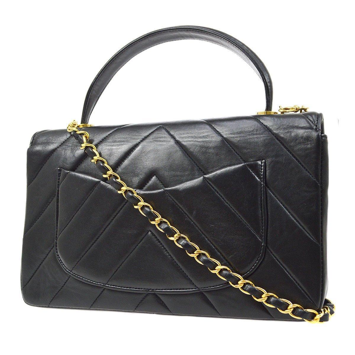 Nero CHANEL Kelly, pelle d'agnello nera trapuntata, borsa a tracolla Chevron con manico superiore