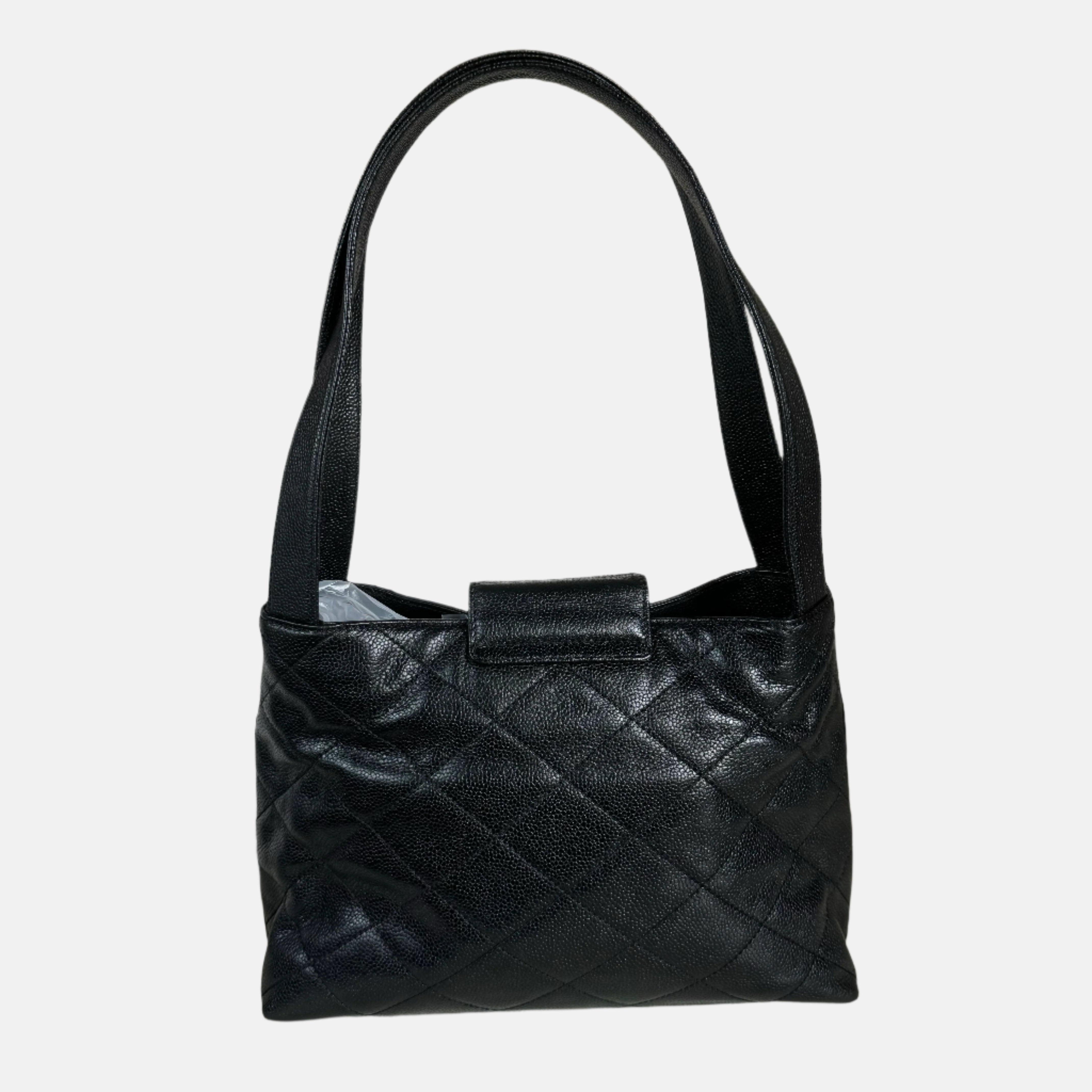 Chanel Kelly Top Handle Bag Black Caviar Leather, 2000-2002
 These are professional photos of the actual bag offered by Luxbags.
 CONDITION: EXCELLENT
 This authentic vintage Chanel bag is in excellent condition with light signs of use throughout.