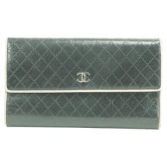 Long portefeuille Chanel L 22ck0109 matelassé bicolore noir beige à fermeture éclair L-gusset