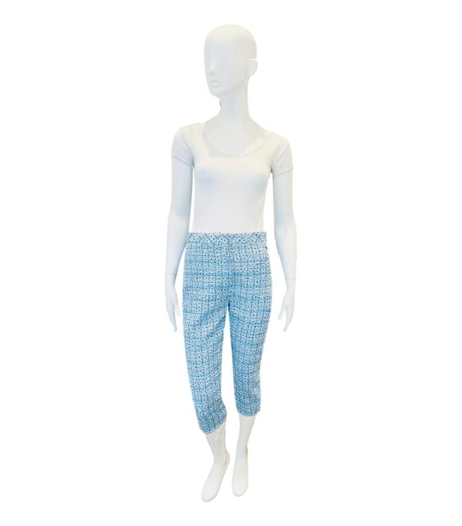 Chanel La Pausa Tweeed Trousers

Pale blue with multiple colours of threads running through the fantasy 

tweed, Cropped leg, zipper and button closure.

'CC- La Pausa' metal medallion to hip.

Lined in silk.

From 2019 cruise collection  - La