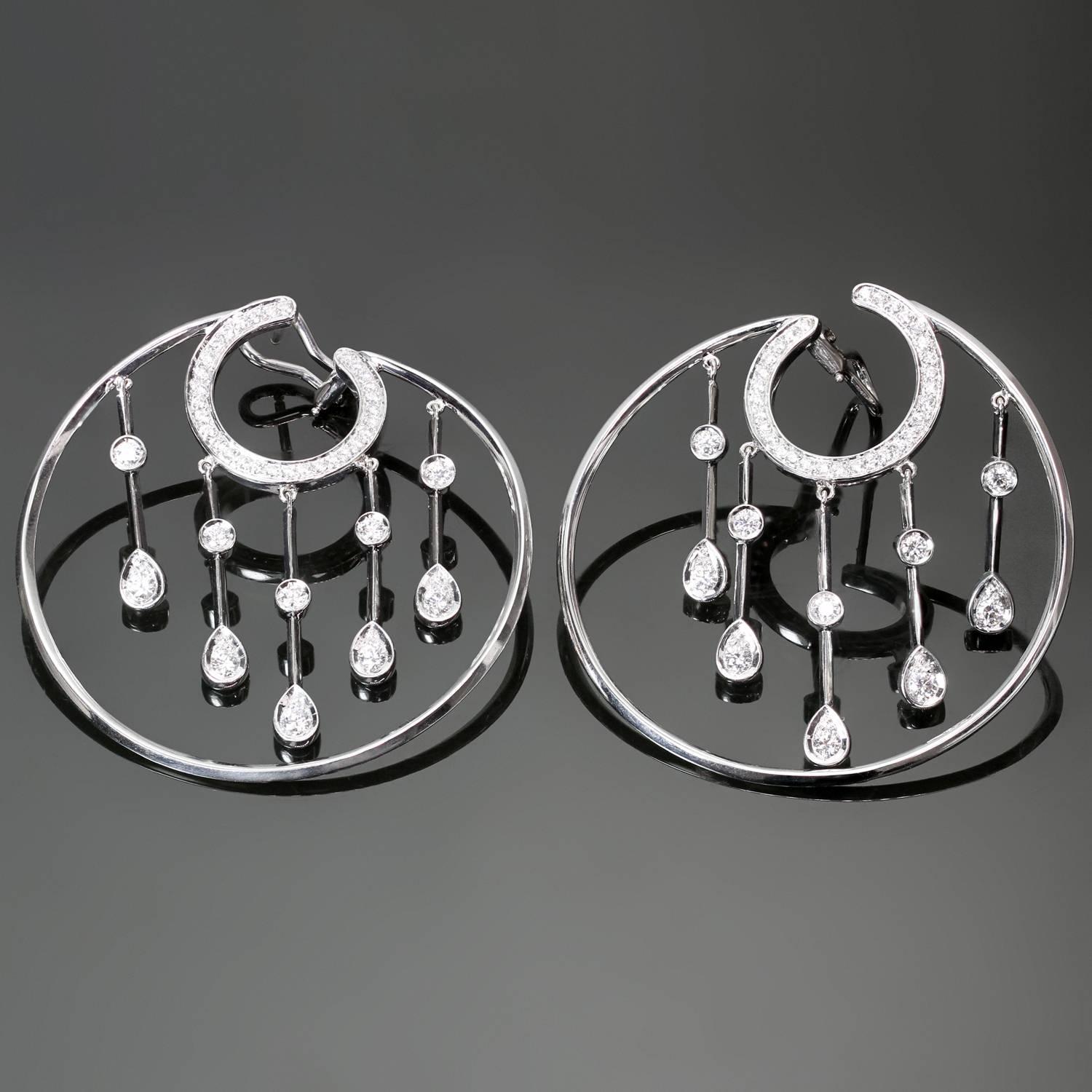 These gorgeous hoop earrings from the La Pluie collection by Chanel feature a circular design accented with dangling drops and are set with brilliant-cut round diamonds of an estimated 1.15 carats in 18k white gold. The custom-made post clips were