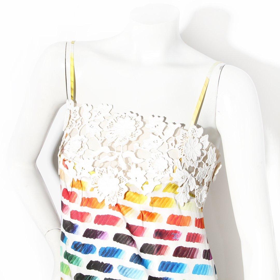 Lace rainbow dress by Chanel
Spring 2014 RTW collection 
Silk dress
Floral lace trim 
Rainbow color swatch pattern 
Spaghetti strap
Zip back and snap closure 
CC logo throughout 
Asymmetrical high-low bottom hem  
100% silk 
Made in
