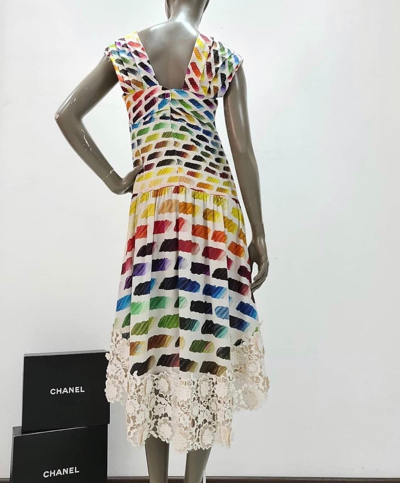 Lace rainbow dress by Chanel Spring 2014 RTW collection.

Silk dress Floral lace trim.

Rainbow color swatch pattern.

Zip back and snap closure.

Asymmetrical high-low bottom hem 100% silk

Condition is very good.

Size 40

For buyers from EU we