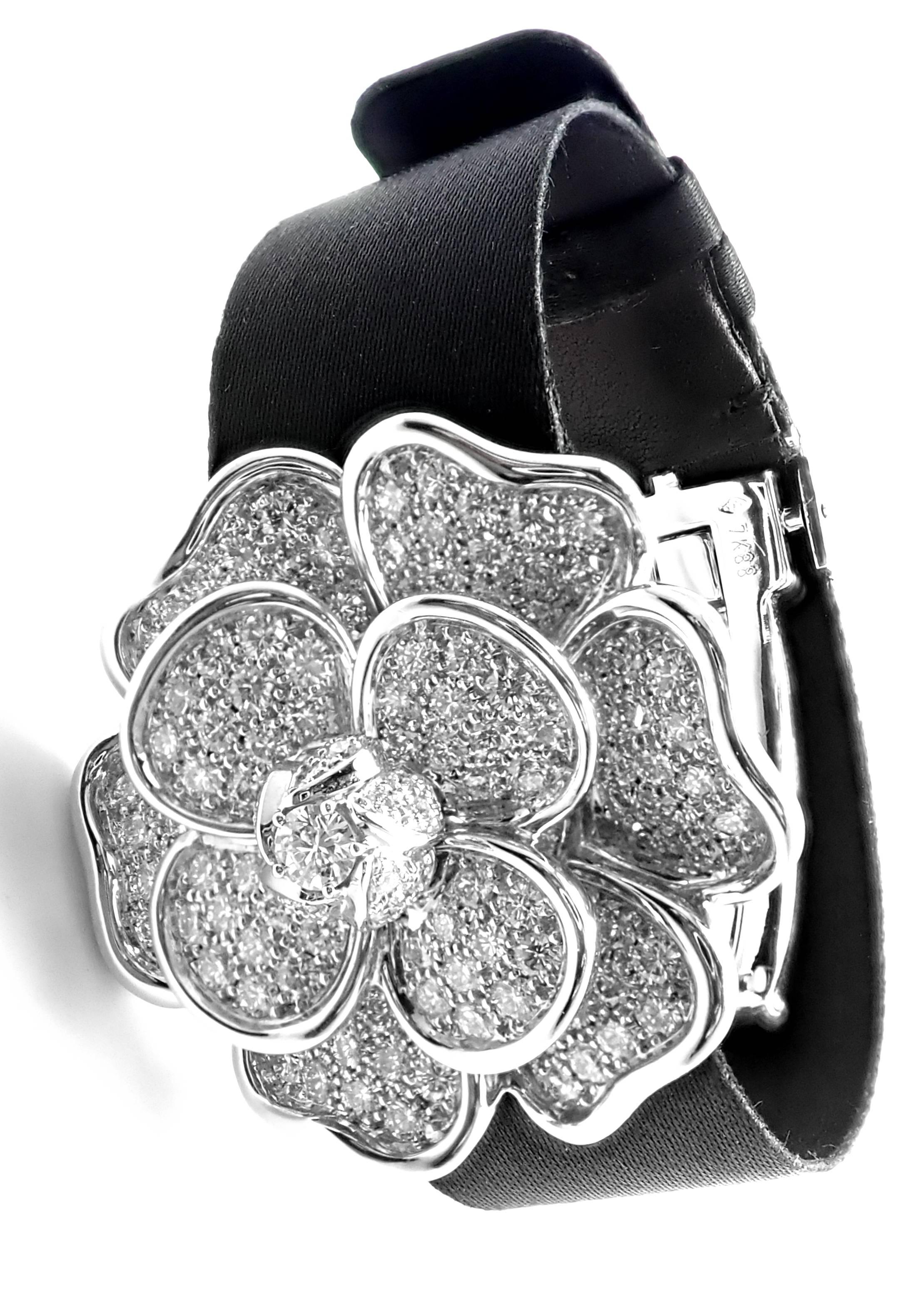 18k White Gold Diamond Secret Camélia Ladies Wristwatch by Chanel. 
This watch comes with Chanel box and a receipt from Chanel store 2003.
With 178 brilliant cut diamonds totaling 4.15 carats, with a central stone fastened at the center weighing