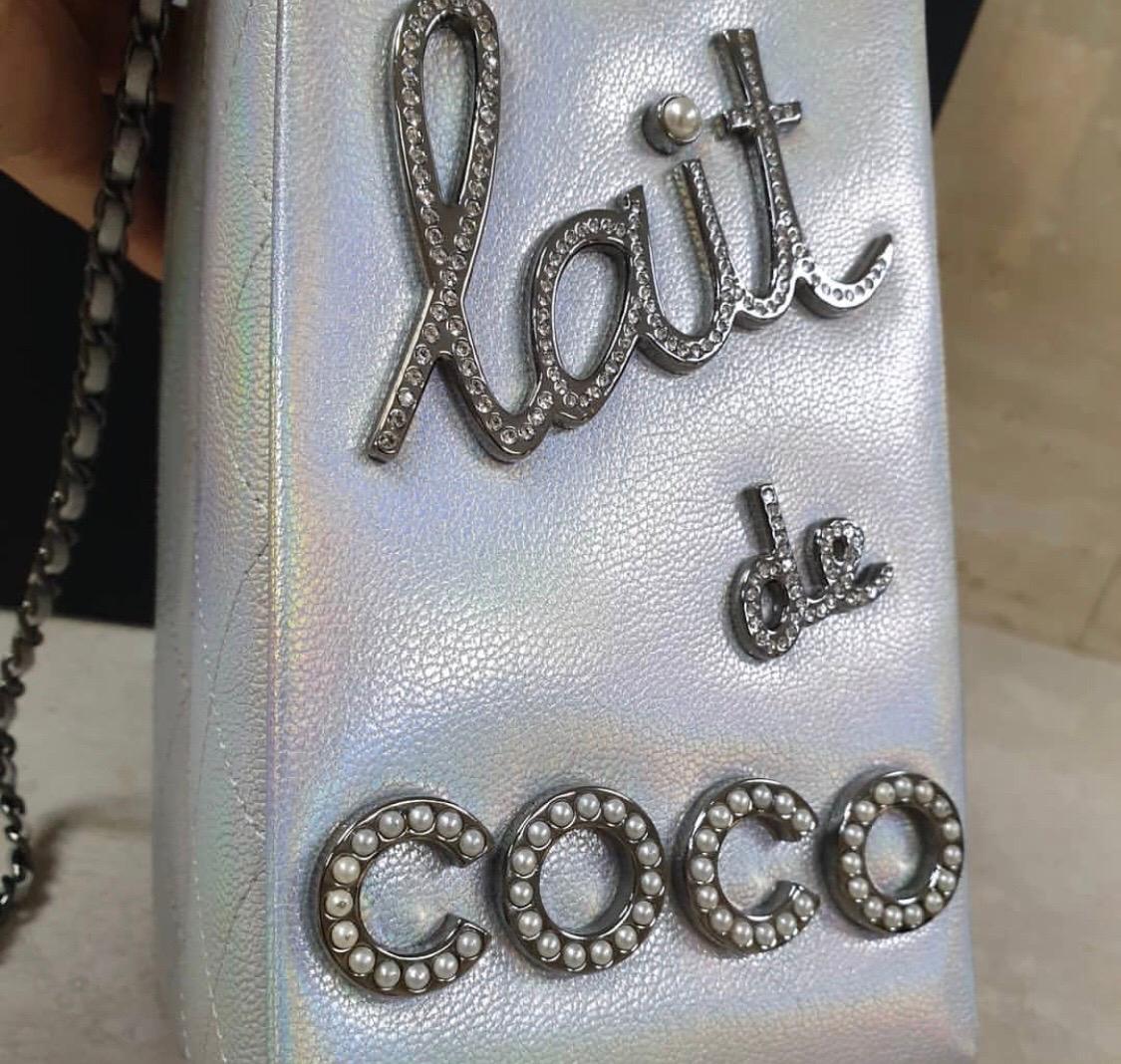 Pour yourself a long, tall glass of Chanel from this Iridescent Silver Lait de Coco Milk Carton Bag! Here's a bag you don't see every day. It's made of iridescent goatskin with diamond-quilted sides and gunmetal hardware, and the front face features