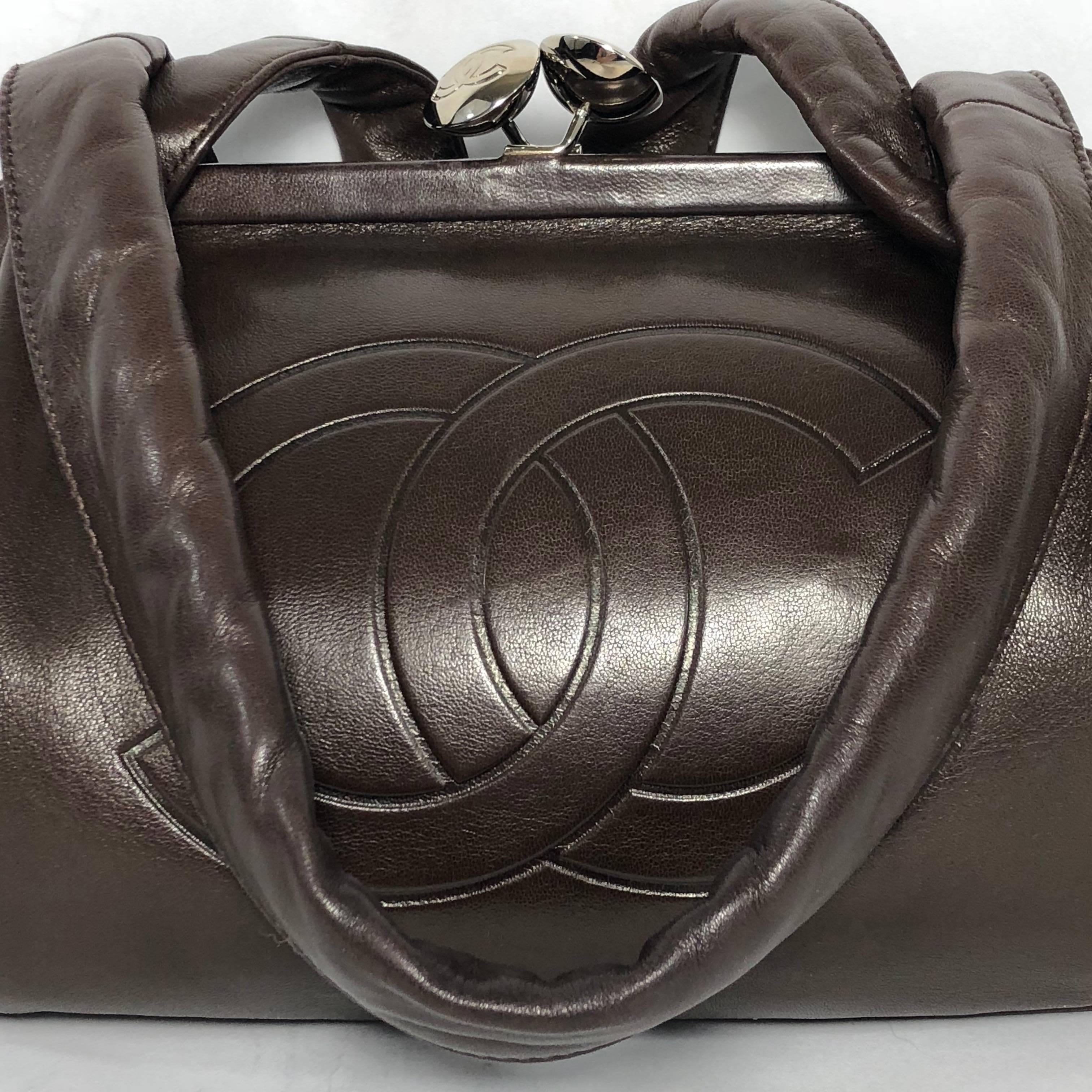 MODEL - Chanel Lambskin Bee Frame Shoulder Bag with Kissing Lock in Chocolate Brown

CONDITION - New! No signs of wear.

SKU - 2165

ORIGINAL RETAIL PRICE - 1995 + tax

DATE/SERIAL CODE - 9249133

ORIGIN - France

PRODUCTION - 2004 to