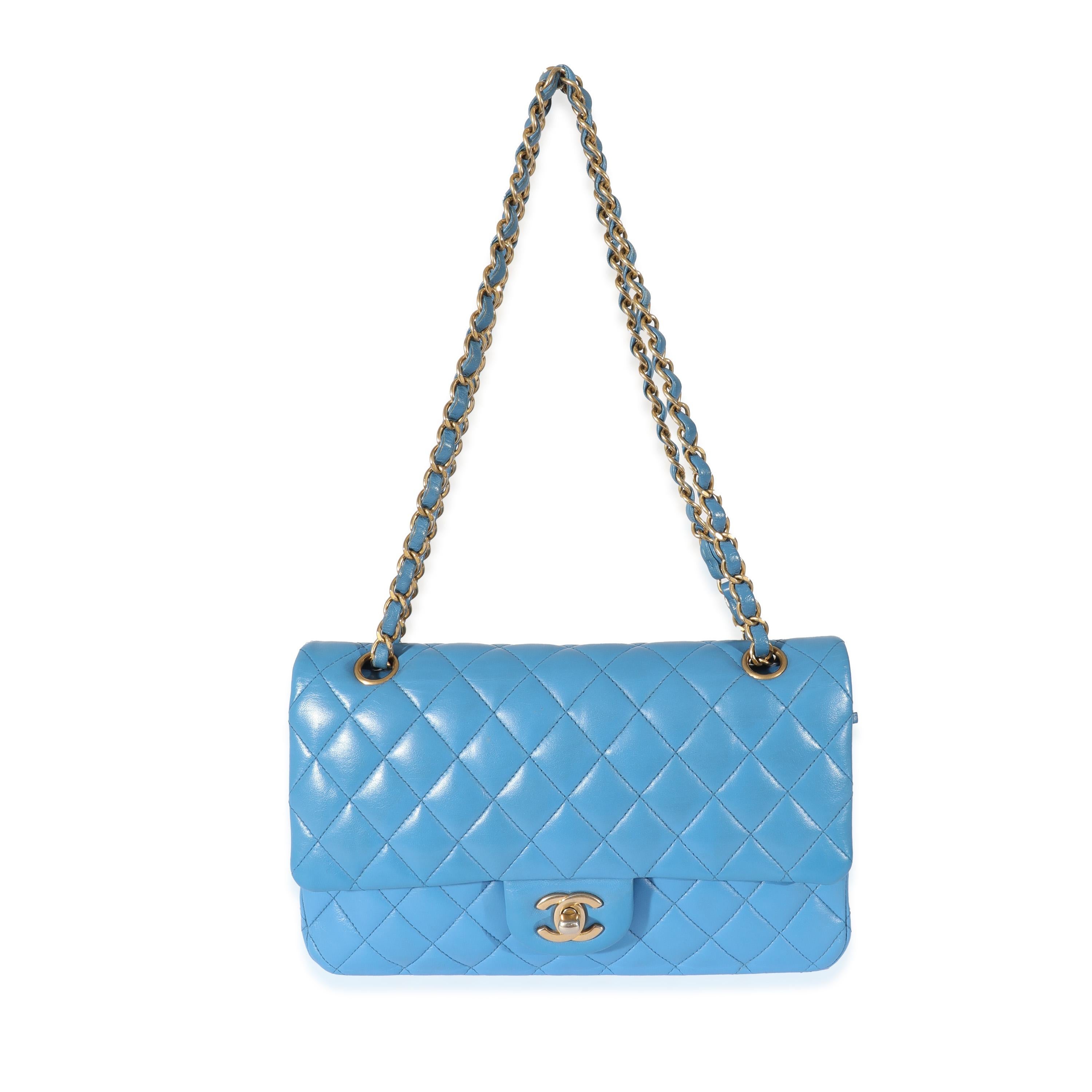 Listing Title: Chanel Lambskin Blue Quilted Medium Double Flap Bag
 SKU: 128242
 MSRP: 8800.00
 Condition: Pre-owned 
 Condition Description: A timeless classic that never goes out of style, the flap bag from Chanel dates back to 1955 and has seen a