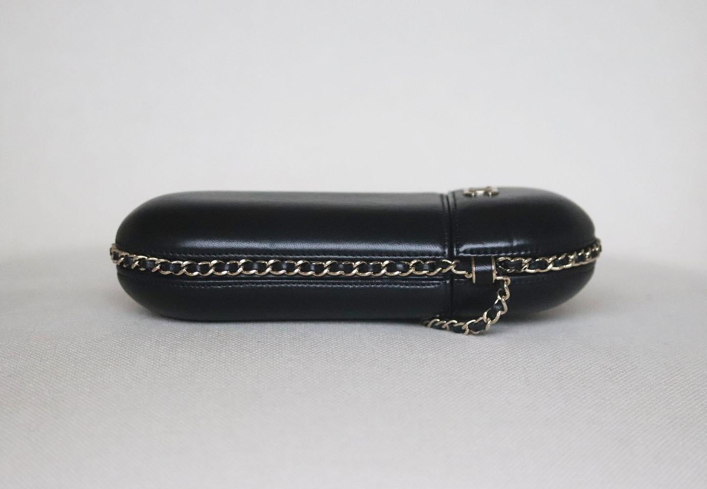 Chanel Lambskin Chain Around Phone Holder Bag has been hand-finished by skilled artisans in the label's workshop, it is boasting a black lambskin exterior, this design is accented with silver-toned and black lambskin-leather chain strap.
Made in