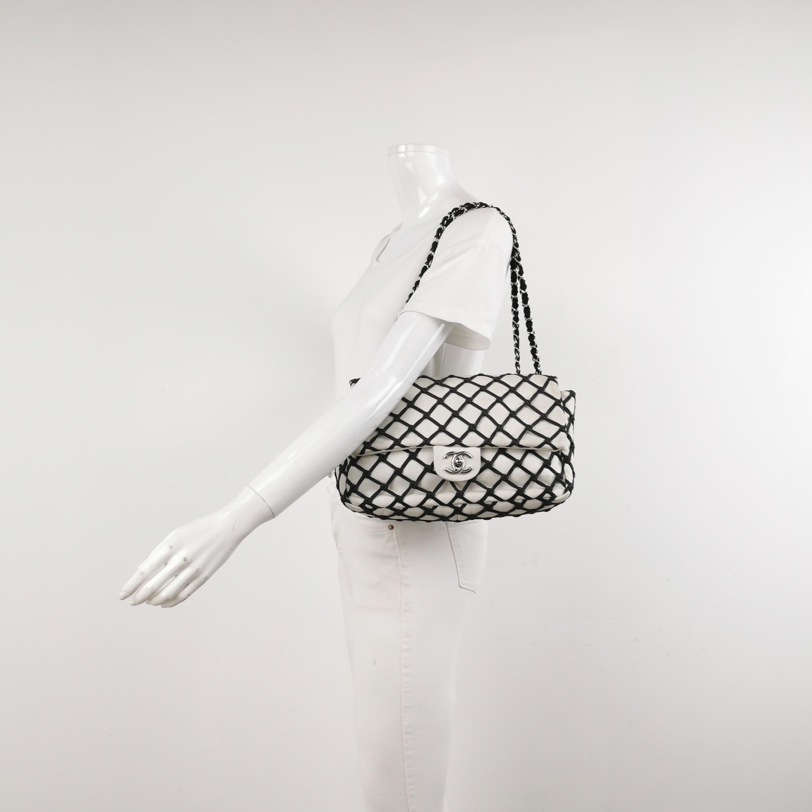 Chanel Lambskin Jumbo Canebiers Net Knots Flap White, 2011
 These are professional photos of the actual bag offered by Luxbags.
 This CHANEL bag is an authentic Lambskin Jumbo Canebiers Net Flap, featuring a classic design and made with smooth
