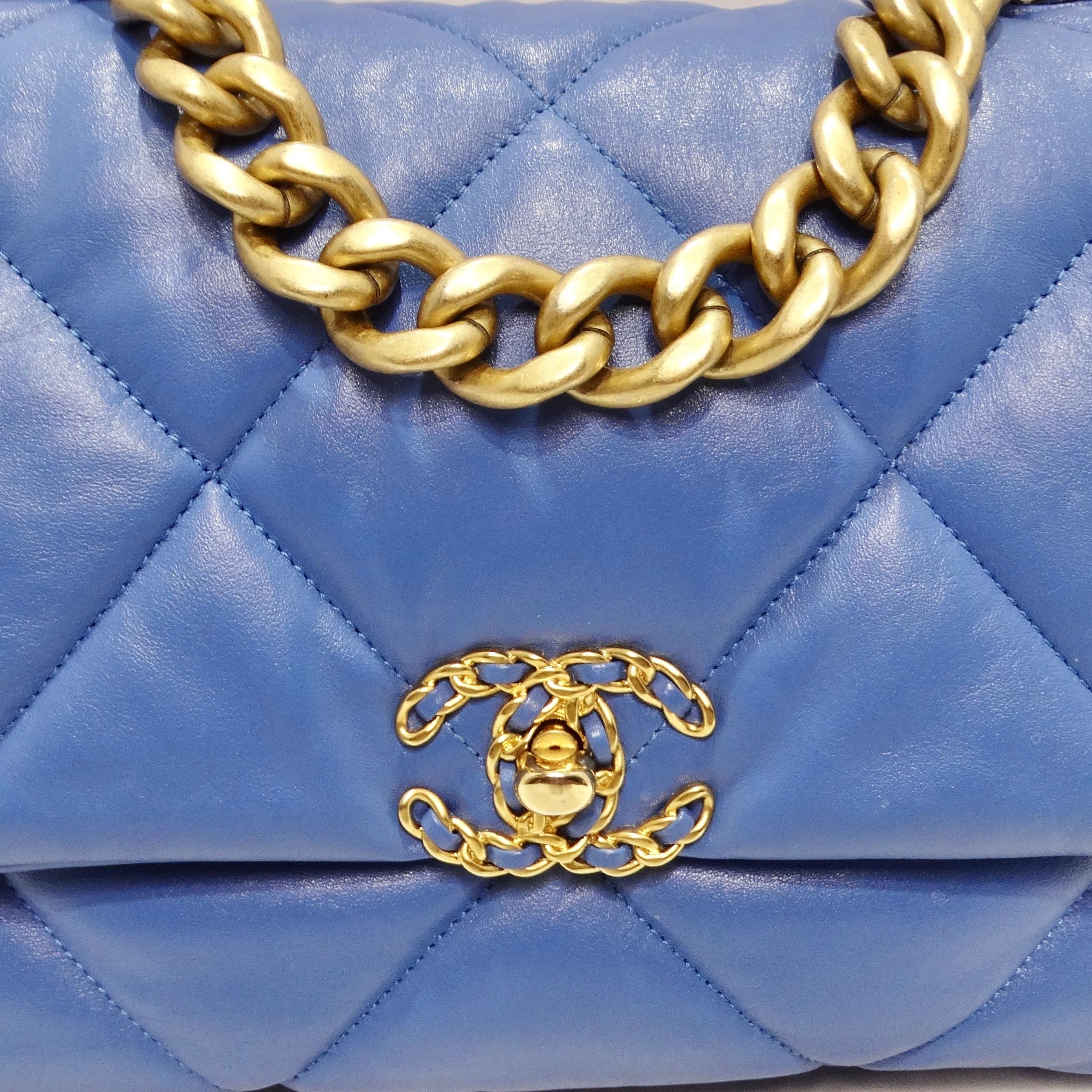 Elevate your style with the Chanel Lambskin Quilted Medium 19 Flap Bag in Blue, an authentic masterpiece that seamlessly combines Chanel's signature quilted lambskin leather with stylish gold and ruthenium hardware. This bag is an authentic Chanel