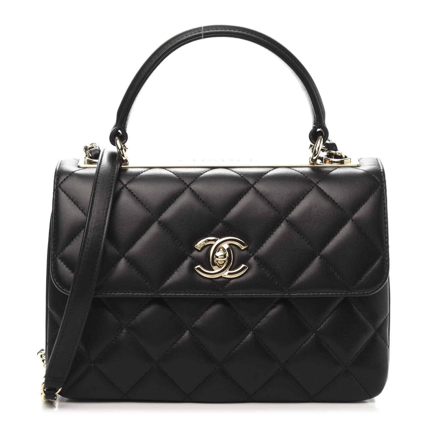 This stylish handbag is made of diamond quilted lambskin leather in black. The bag features a reinforced leather top handle with a gold bar with a Chanel logo and a removable gold chain leather threaded shoulder strap with a shoulder pad. The flap