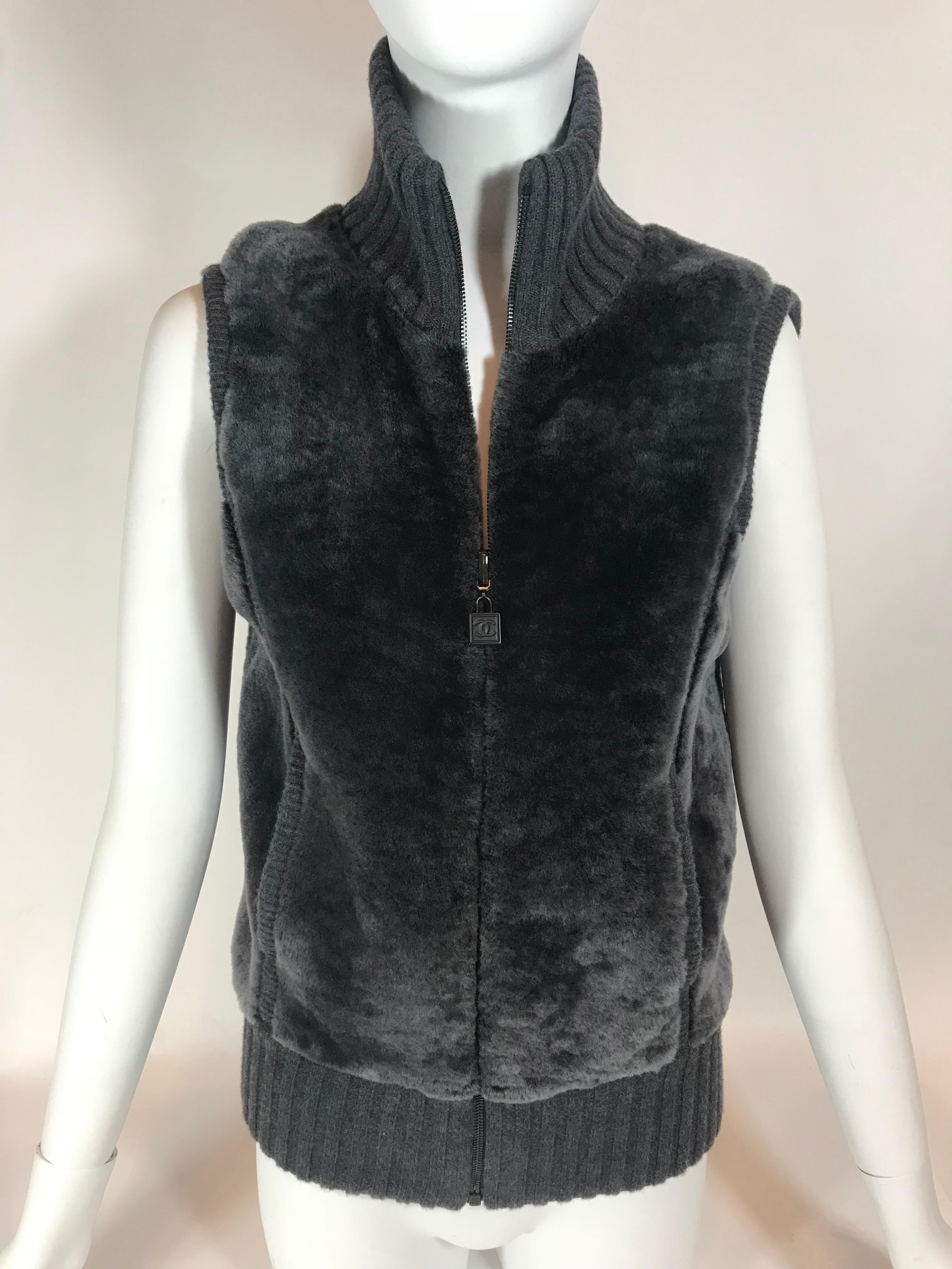 From fall 2009 collection. Gray 100% lambskin. Wool and cashmere blend lining. Dark gun metal hardware. Turtle-neck. Full front zipper up closure. Ribbed design.
