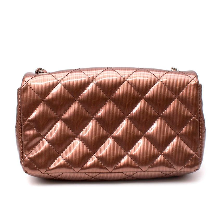 Chanel Laminated Metallic Copper Leather Mini Flap Bag
 

 - Mini flap bag crafted from laminated rose-toned bronze leather featuring signature diamond quilting
 - Unusual pink-toned metallic bronze colour given added dimension by the linear