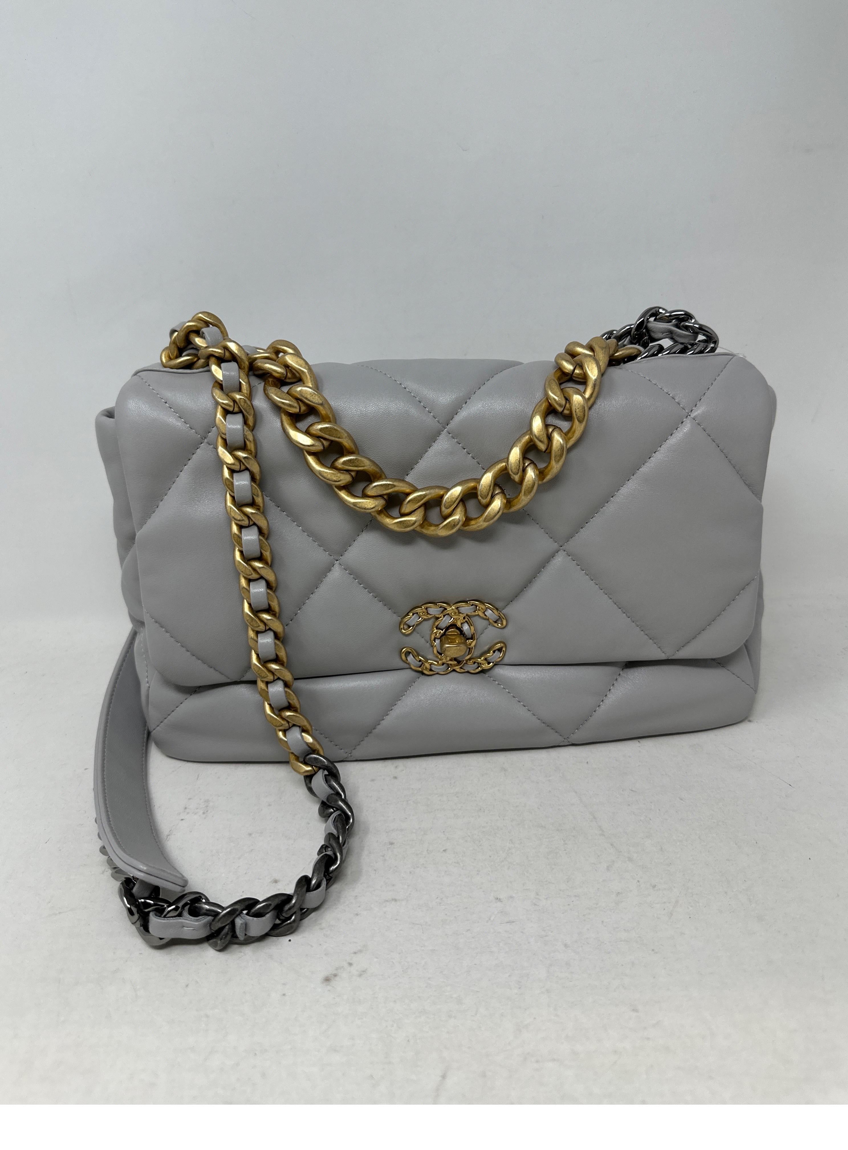 Chanel Grey 2022 Bag. Large size. Soft leather with two-tone hardware. Excellent like brand new condition. Interior clean. Light grey color that will go with everything. Microchip inside. Includes Chanel dust bag. Guaranteed authentic. 