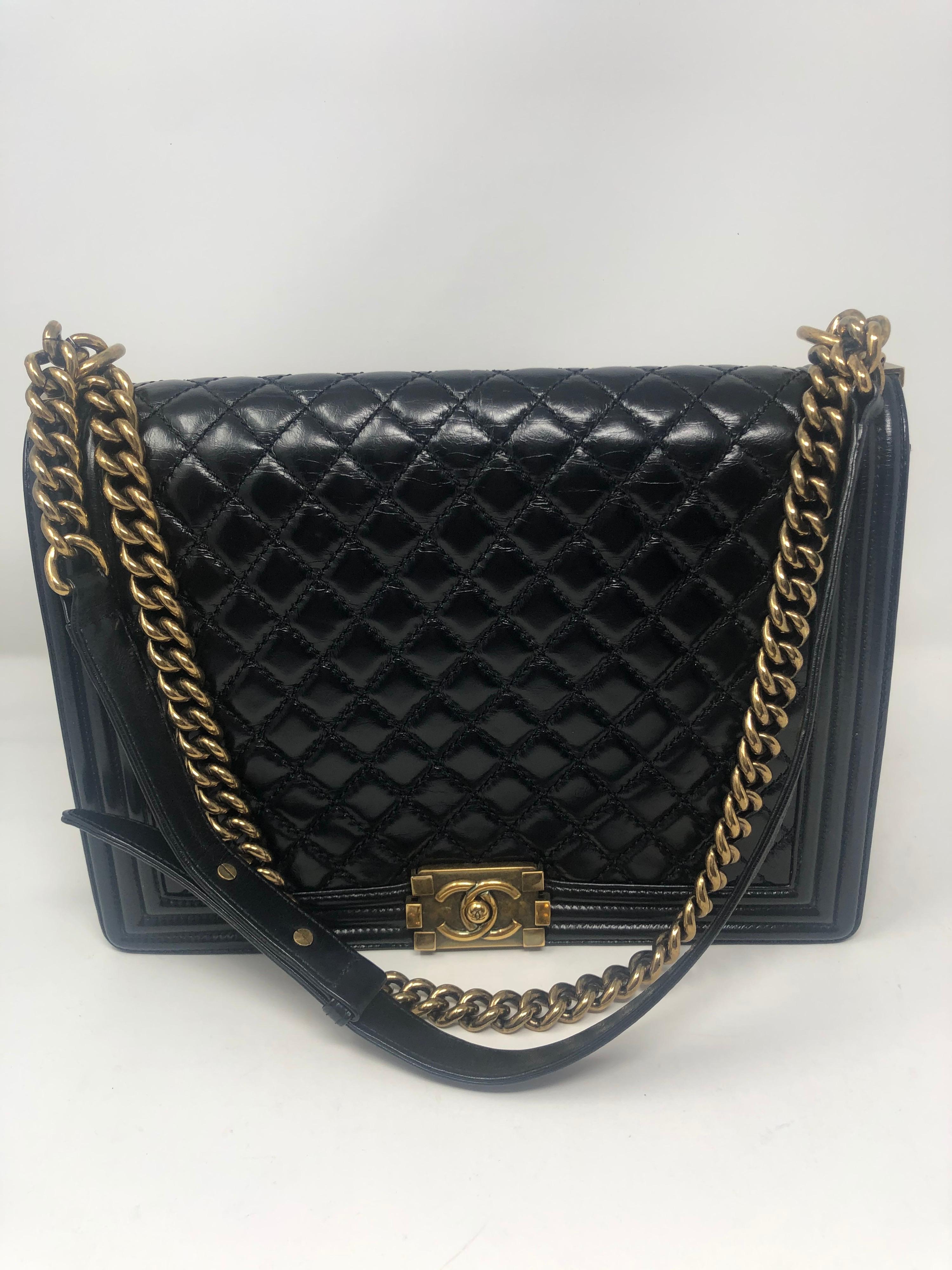 Chanel Boy Large Black Bag. Chanel lambskin with antique gold hardware. Large size can be worn crossbody or doubled as a shoulder bag. Excellent condition. Great investment bag. Guaranteed authentic. 