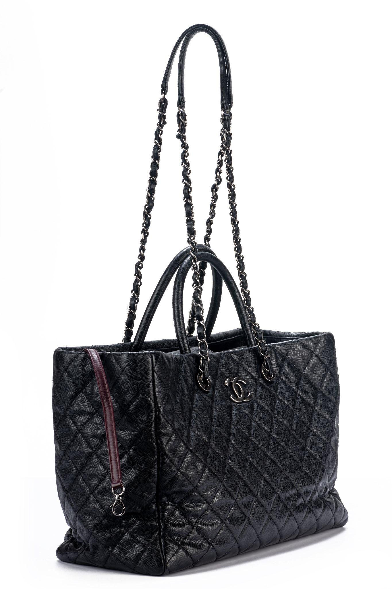 CHANEL large black 2 way caviar tote. Handle drop 4.5”, shoulder drop 14”. Interior detachable center pouch. Key strap.Interior zipped pocket. Back open pocket. Comes with hologram, ID card and original dust cover. Collection 23.