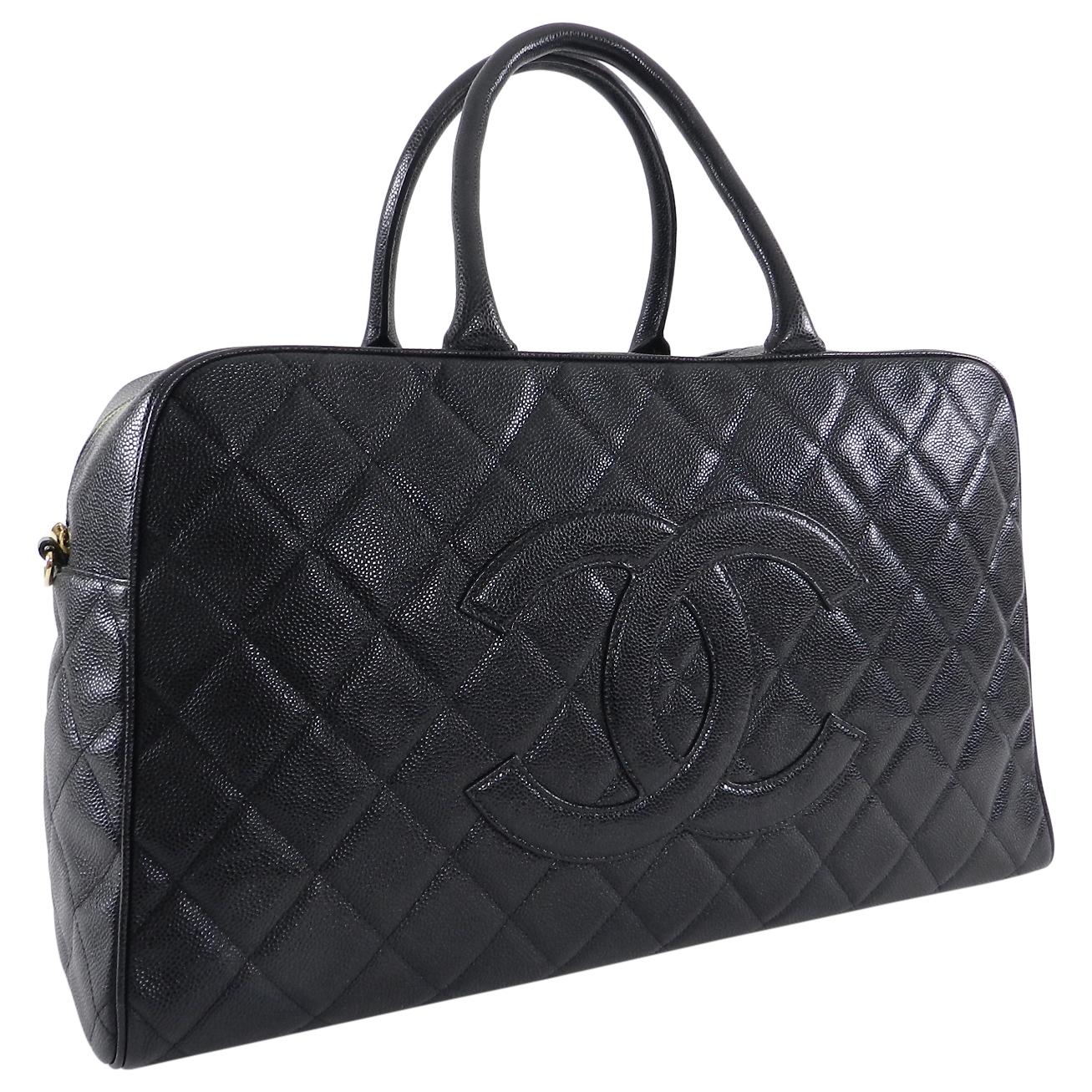 Chanel Large Black Caviar CC Zip Top Overnight Duffle Bowling Bag.  Date code 8-series for production year 2003-4.  Large CC logo caviar leather duffle bag with gold-tone metal zippered top.  Double rolled leather handles and roomy lined interior. 