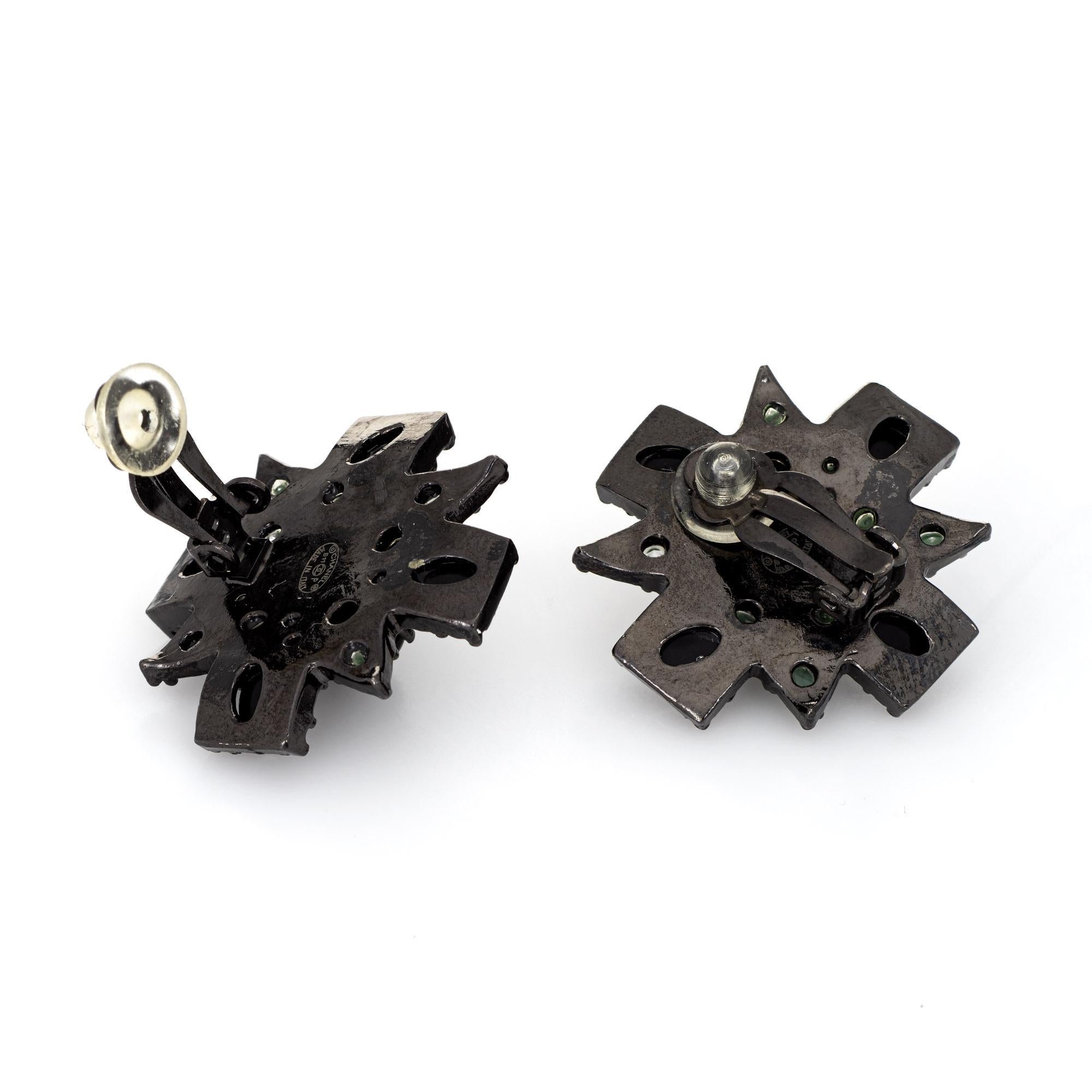 Pre-owned Chanel large black cross earrings (circa 2011).

The earrings feature the CC logo set upon the large black enameled cross earrings. The earrings are fitted with clip on backings for non-pierced or pierced ears. The earrings date to the