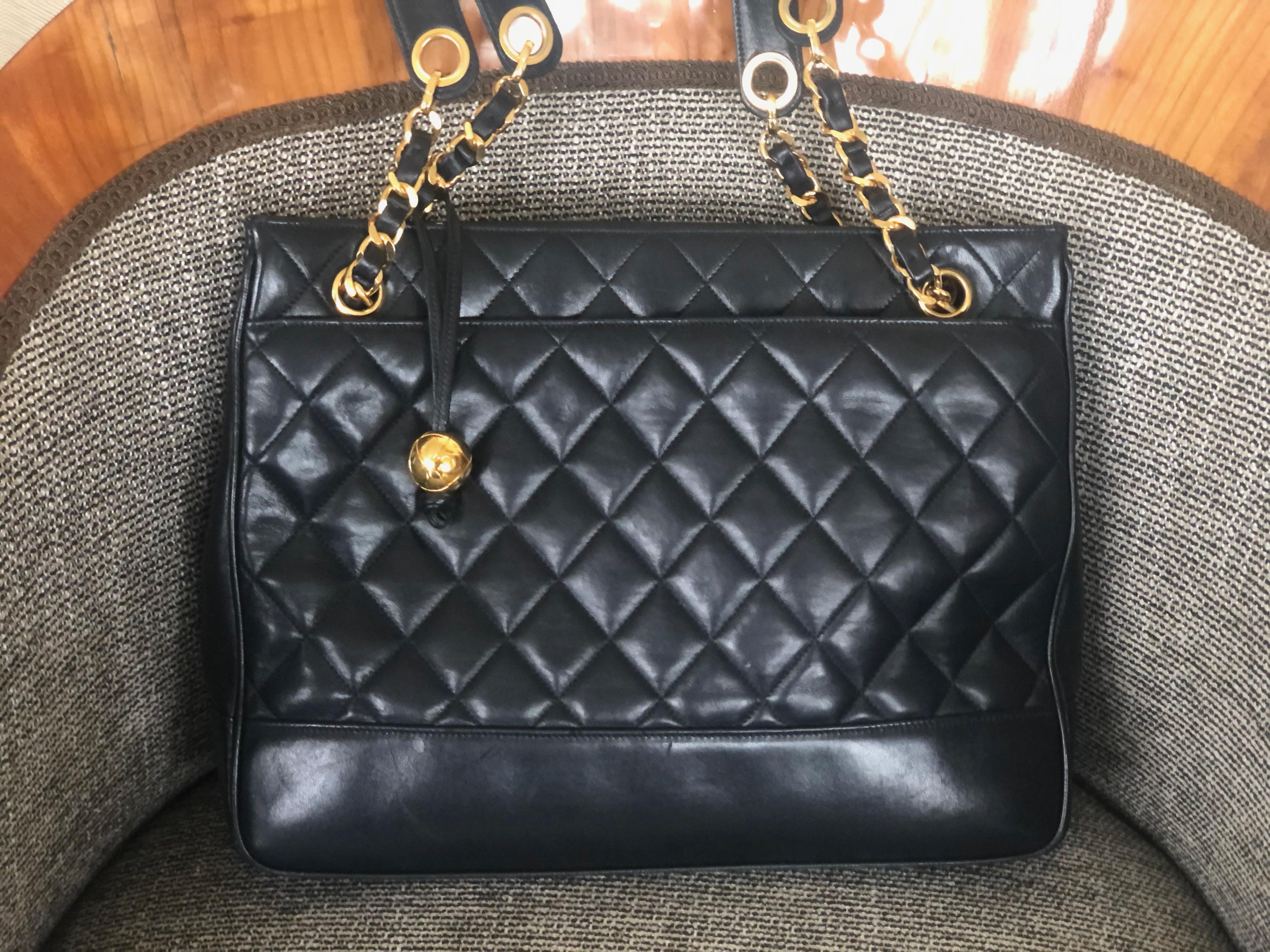 Chanel Large Black Leather Shoulder Bag with Gold Hardware and Quilted Details .
12