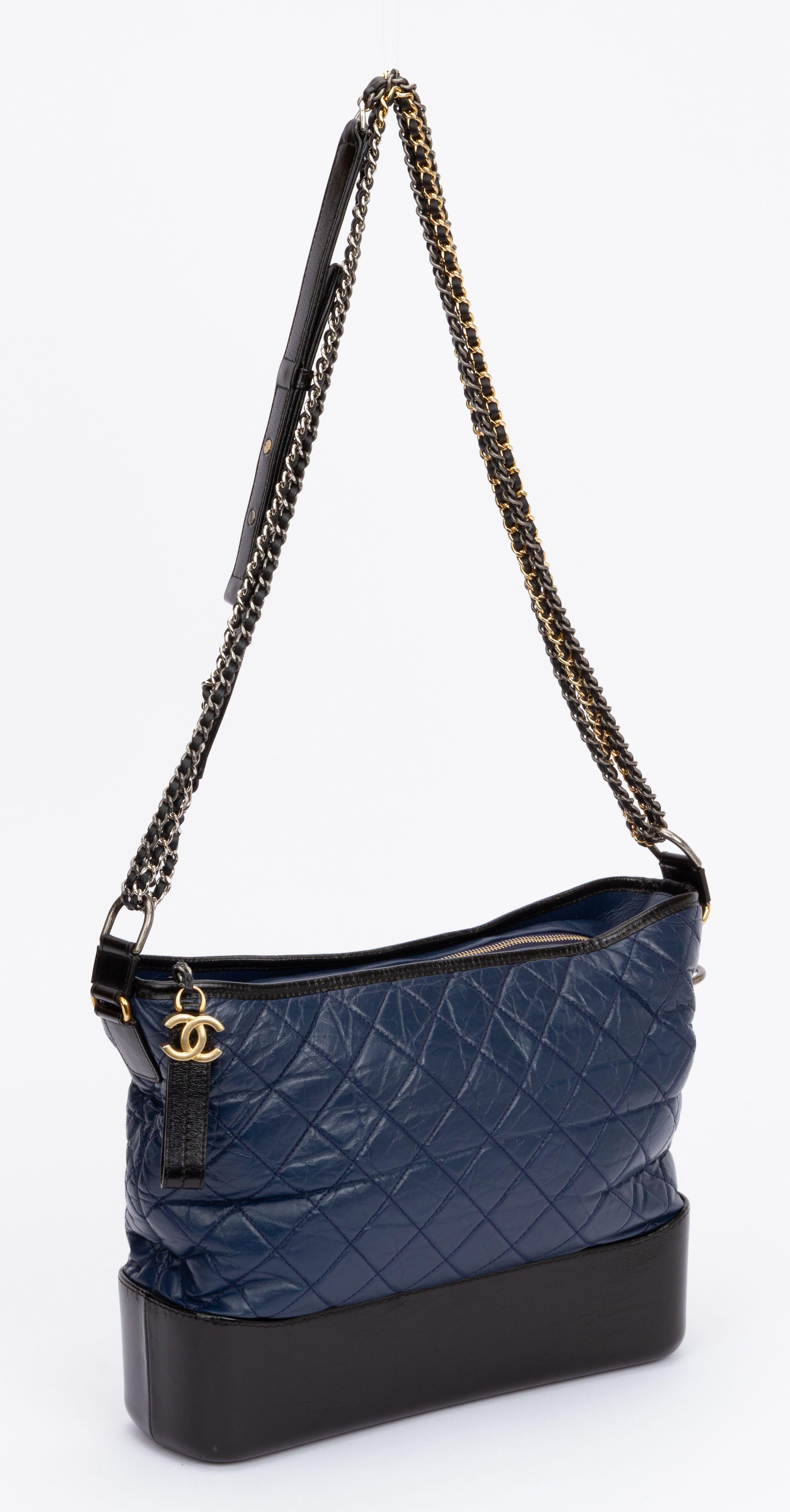 Chanel large Gabrielle bag in black and blu leather combination. Gold and ruthenium hardware. Shoulder strap drop 18.5
