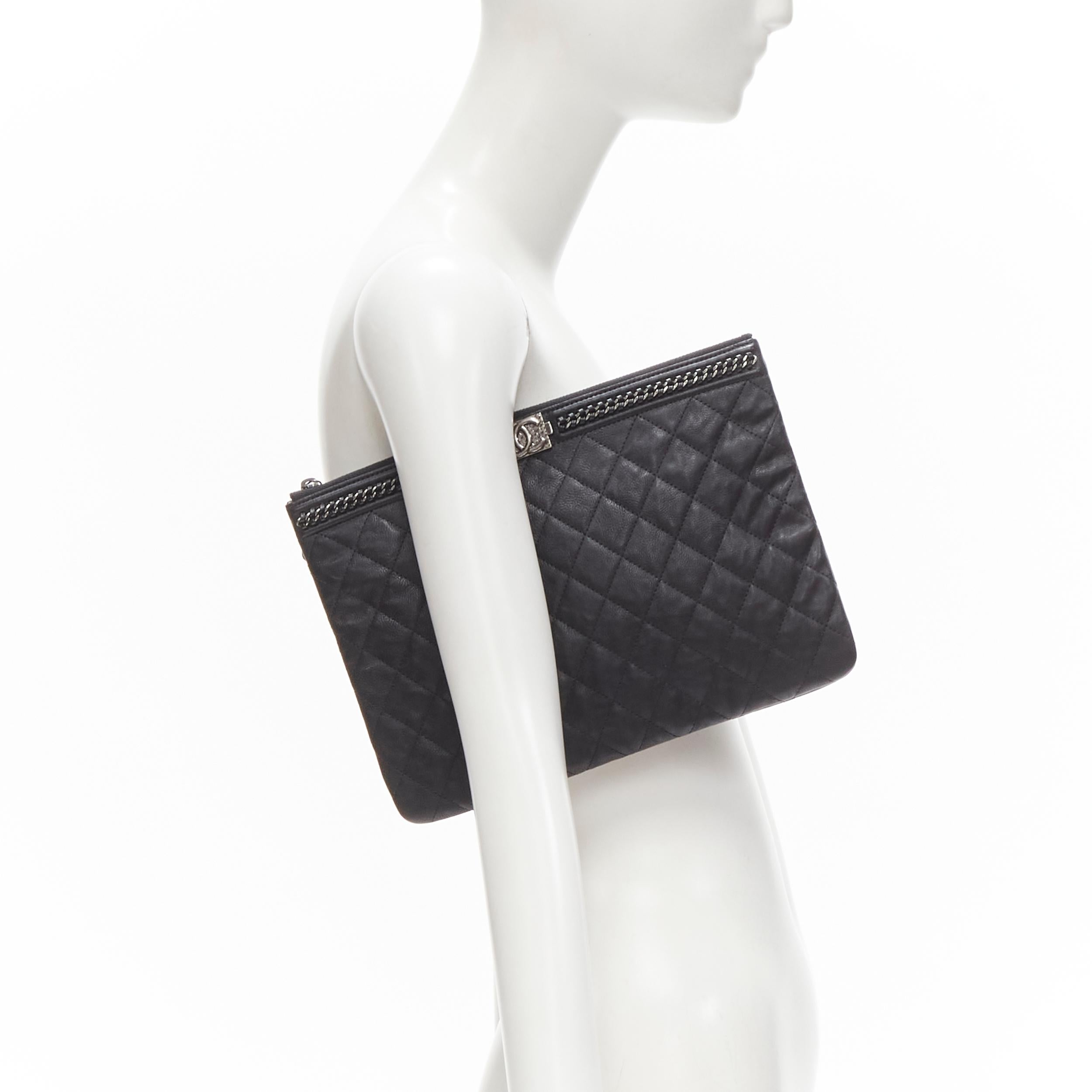 CHANEL Large Boy O Case black quilted leather chain trim flat pouch clutch bag 
Reference: TGAS/C01209 
Brand: Chanel 
Designer: Karl Lagerfeld 
Model: O Case 
Material: Leather 
Color: Black 
Pattern: Solid 
Closure: Zip 
Extra Detail: Hammered CC