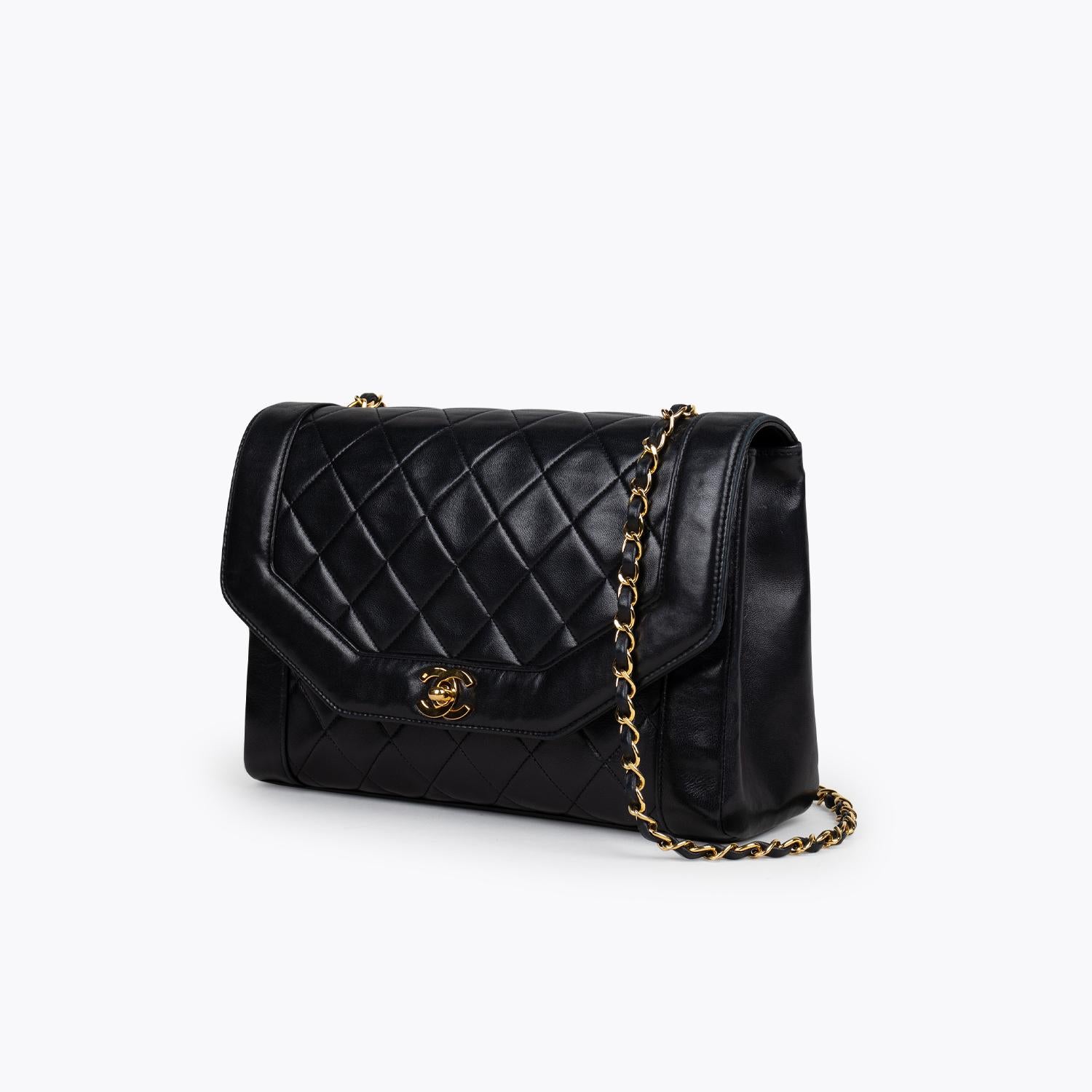 Black quilted calfskin Chanel Large Diana Flap bag with

– Gold-tone hardware
– Single chain-link and leather shoulder strap
– Burgundy leather interior, dual interior pockets; one with zip closure and interlocking CC turn-lock closure at front