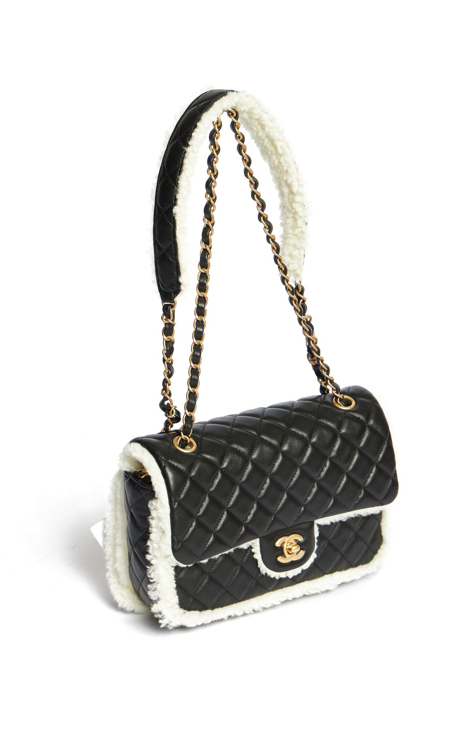 Chanel large flap bag with sheep fur on the outside trim, on the inside of the flap and partly on the shoulder chain. The bag is brand new. The time stamp shows LN1, year 2021. Even the plastic cover is still over the stamp as well as over the