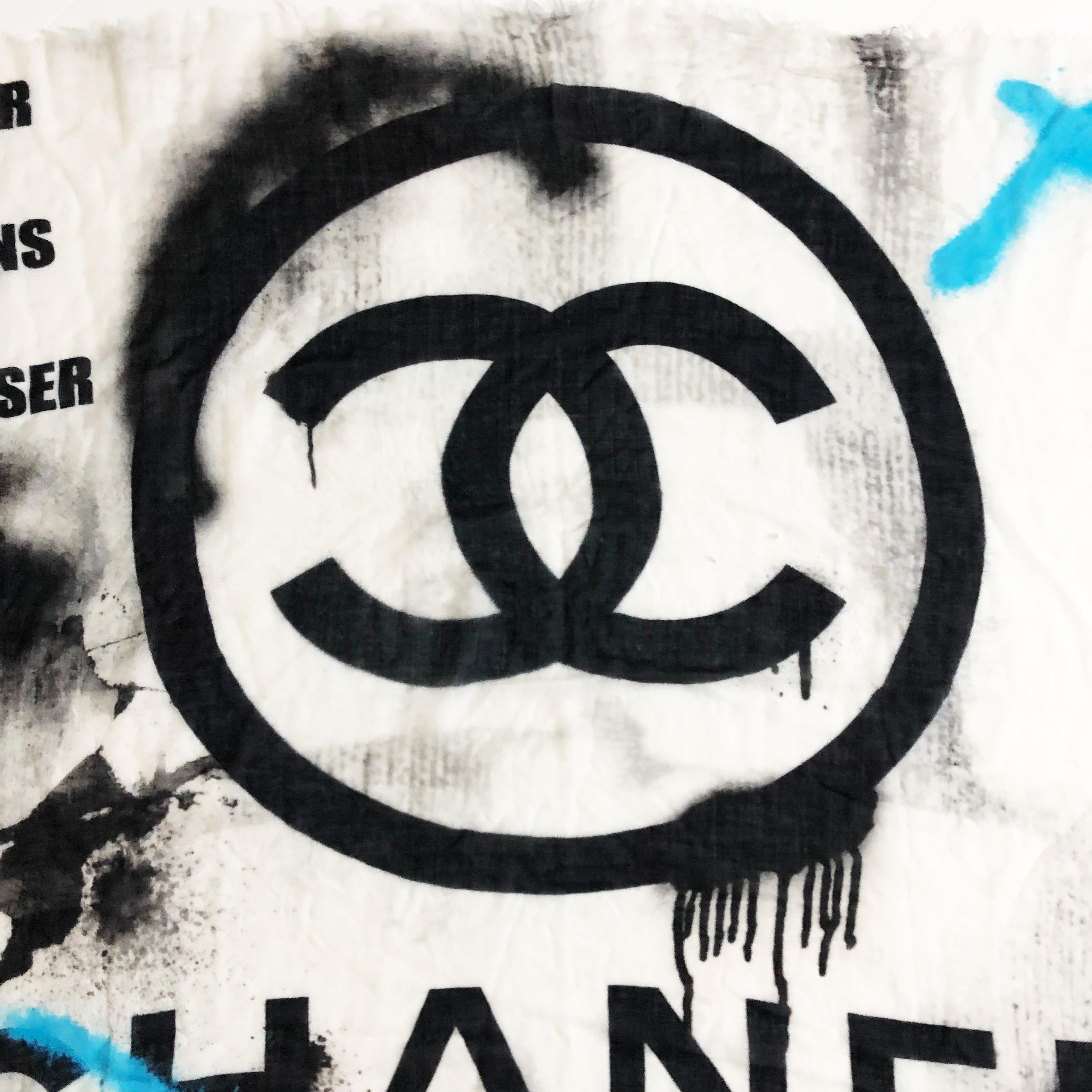 Authentic, preowned Chanel Large 51in Cashmere Graffiti Scarf Shawl with unfinished fringed edges.  Long sold out.  Comes with its box.  Measures 51in square.  Preowned with minimal signs of prior wear, we note some small pulls opposite the side