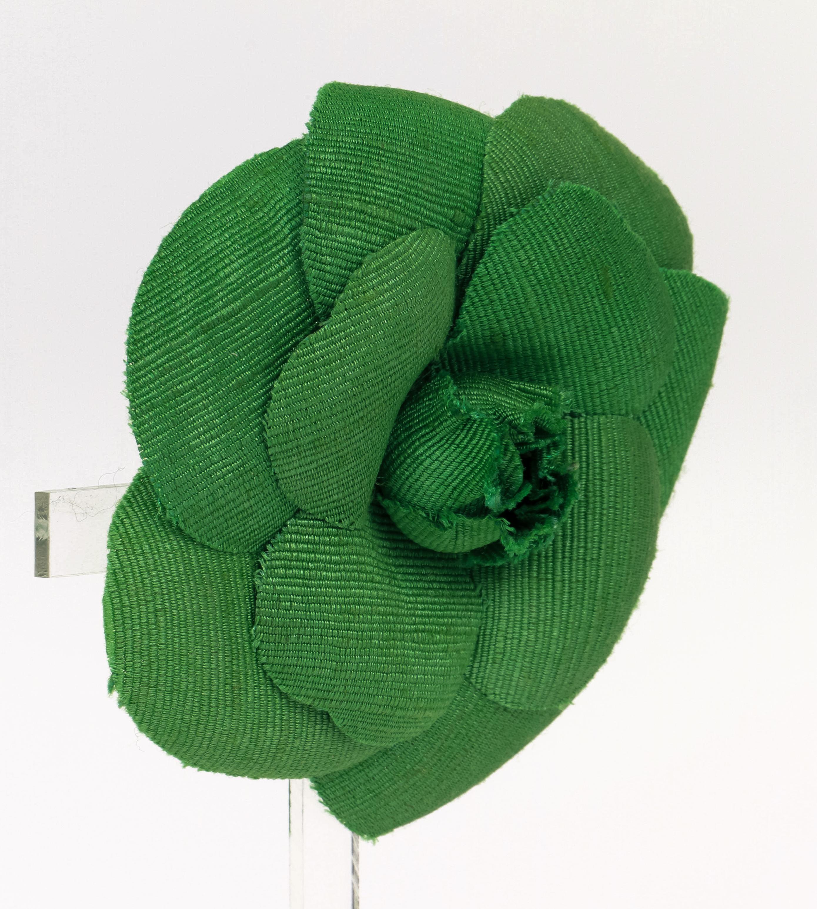 Chanel large green fabric camellia brooch. Comes with velvet pouch.
