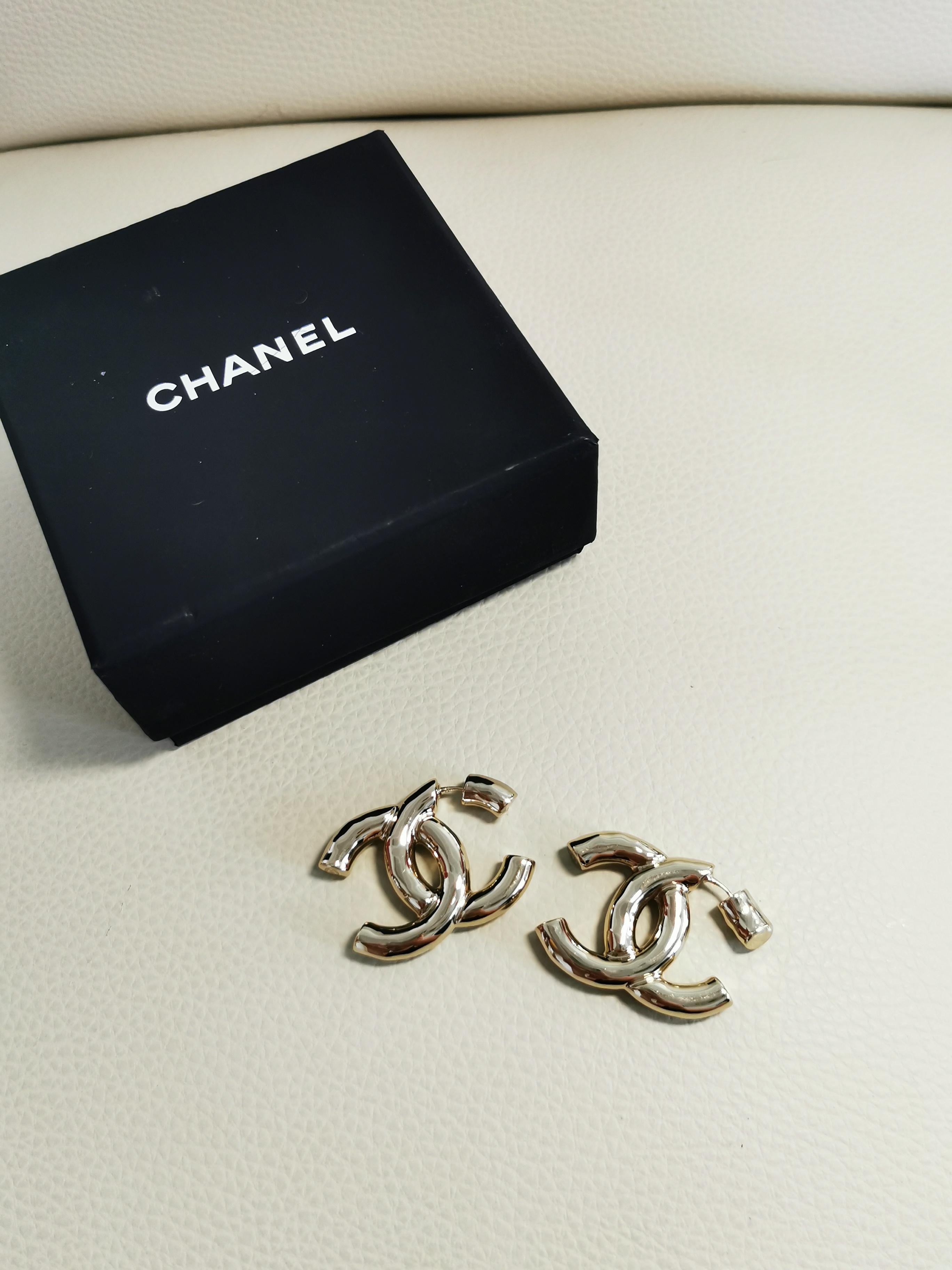 Make a bold statement with the Chanel Oversized CC Logo Earrings, a symbol of timeless elegance and iconic design from the house of Chanel. These earrings feature oversized interlocking CC logos, meticulously crafted to exude luxury and