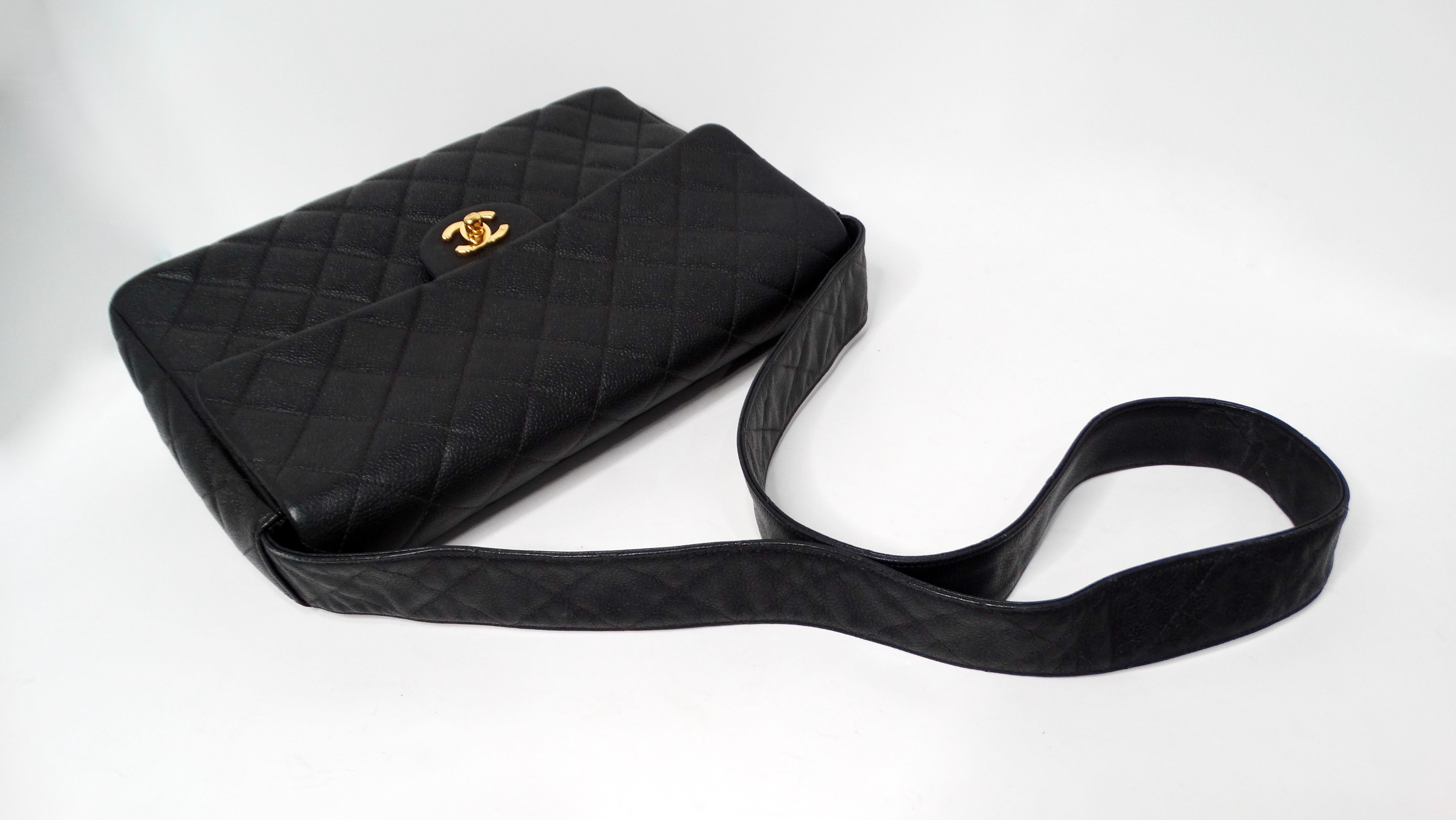 The Chanel Large Quilted Caviar Leather Interlocking CC Messenger Shoulder Bag is a timeless piece that exemplifies luxury and sophistication. Crafted from durable caviar leather, this bag features the iconic quilted pattern that Chanel is renowned
