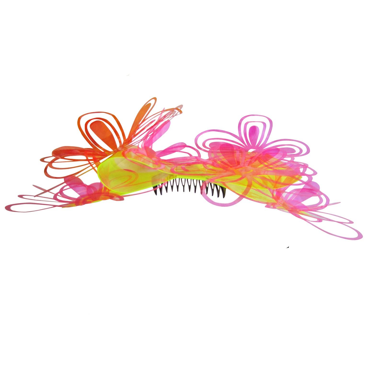Rare Chanel oversize vivid pastel colour hair clip piece from collection SS 1995.
Three dimensional overlapping flowers are held with bright yellow large ribbon on the bottom with black comb, in original box. 
Measurements :  approx. 27 x 13 cm 