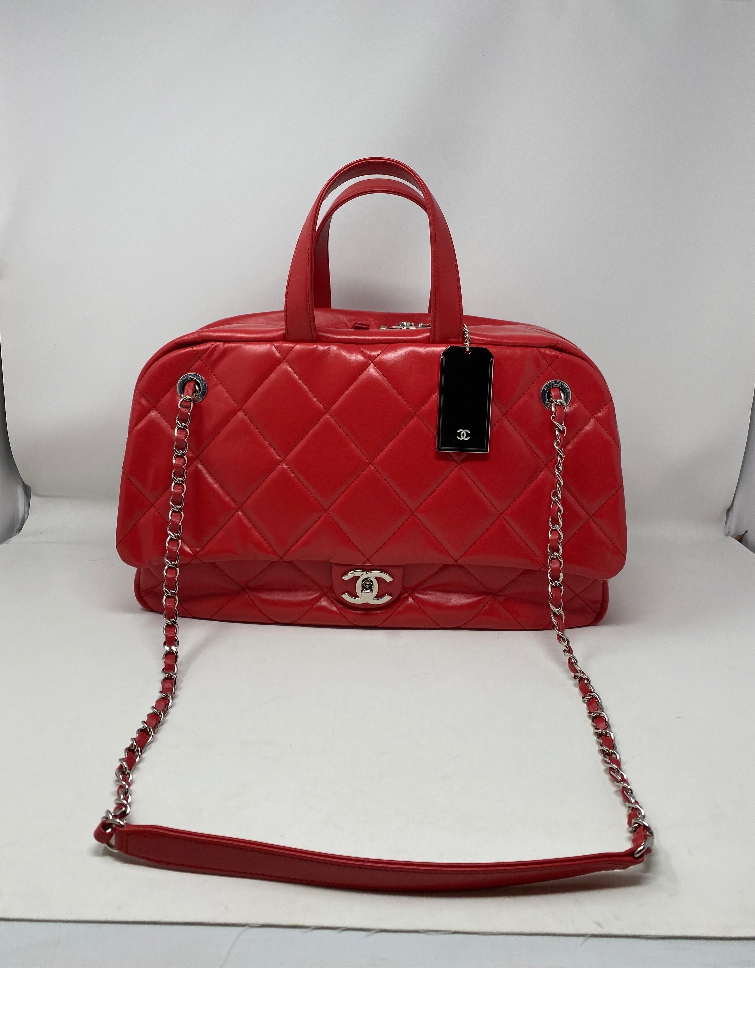 Chanel Large Red Bowler Bag. Mint like new condition. Bag was never worn. Beautiful bright red leather. Looks like the XXL airline bag. Similar in shape. This bag can be worn as luggage or as a big purse. Silver hardware. Great looking bag. Don't