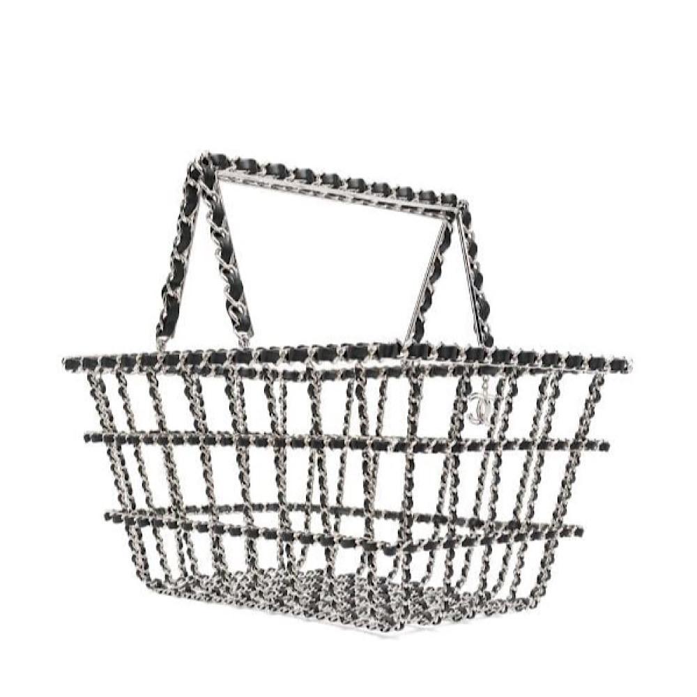 Extremely Rare and collectable Chanel large Shopping basket handbag, silver plated metal and black calf leather. The theme for the Fall Winter 2014 Collection was ‘supermarket’, this Chanel Basket Bag is one of the most creative and fun bags made