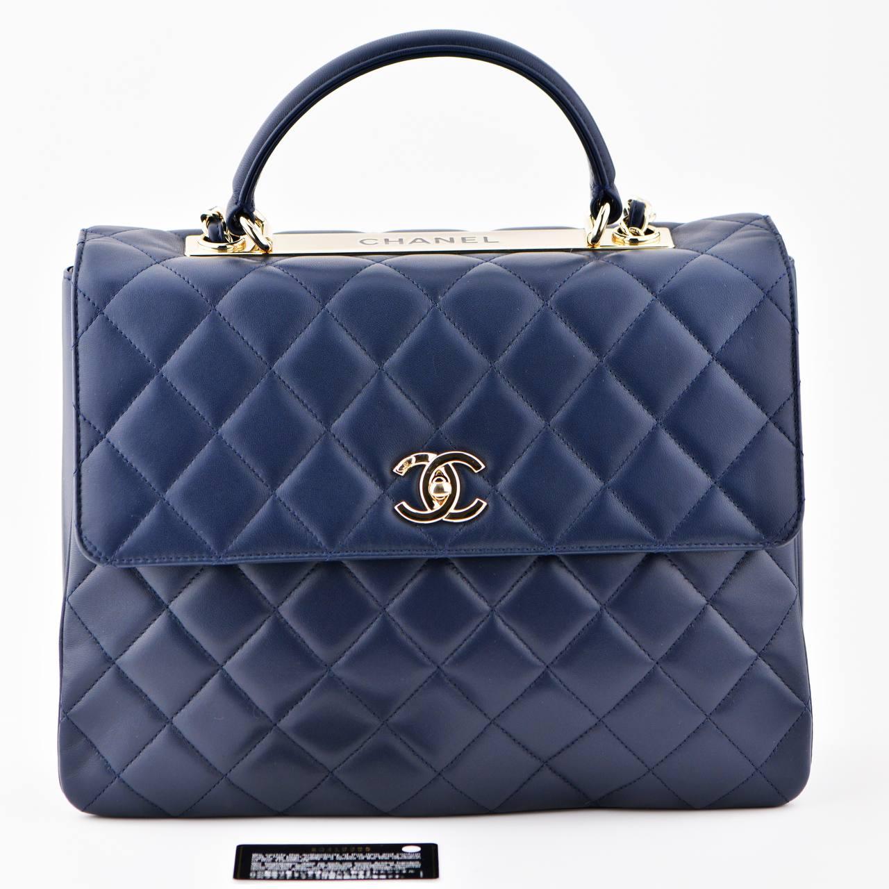 SKU 	AT-1613
Brand	Chanel
Model	Trendy CC Top Handle
Serial No  20******
__________________________________________________________________________________
Color	Navy
Date	Approx. 2014-2015
Metal	Gold
Material	Lambskin Leather
Measurements	Approx.