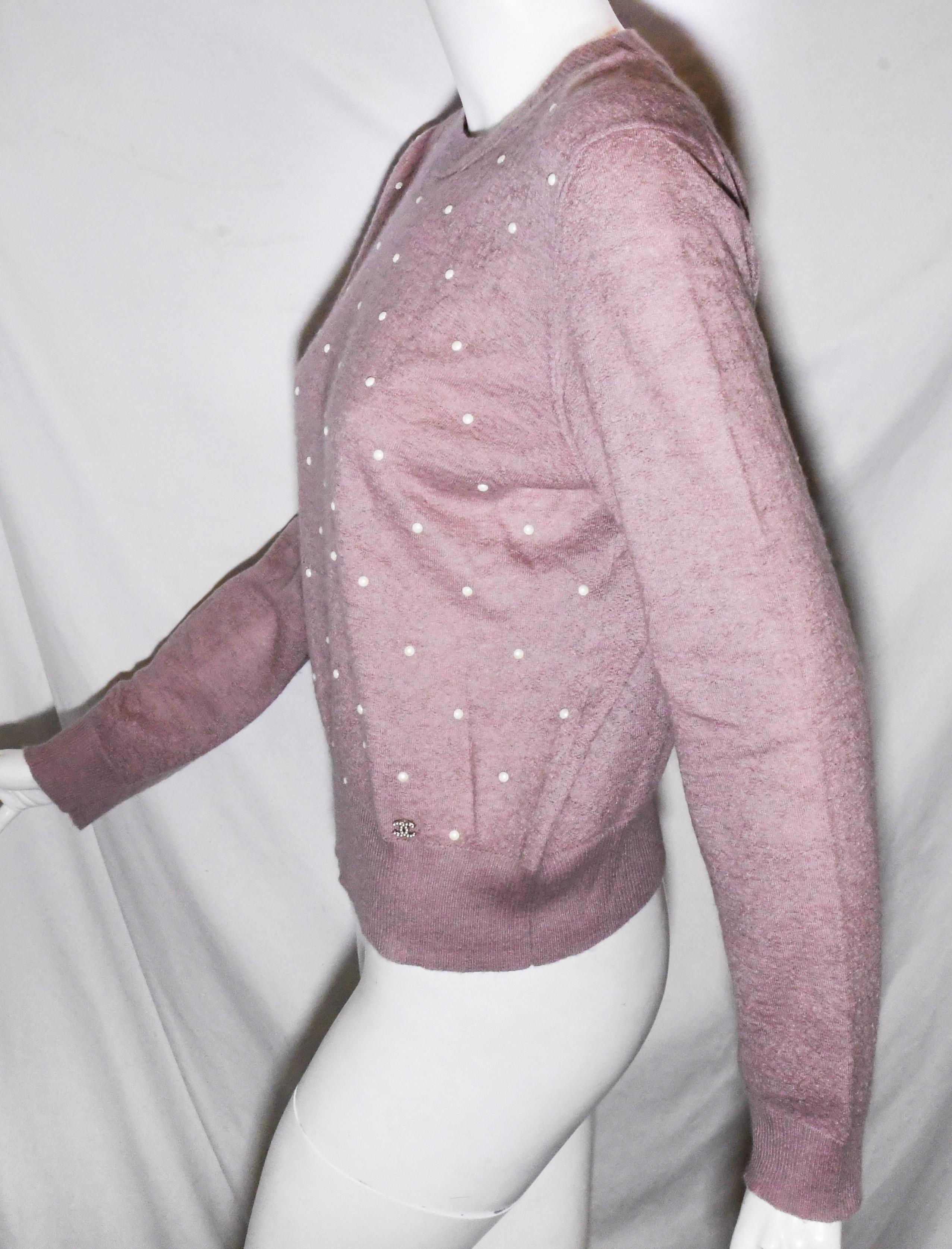 Chanel lavender mohair and cashmere blend  long sleeve sweater.  This sweater is embellished with faux pearls dots allover the front.  This pullover is from the pre fall 2014 collection.  Cozy up with this gorgeous Chanel pullover sweater. 