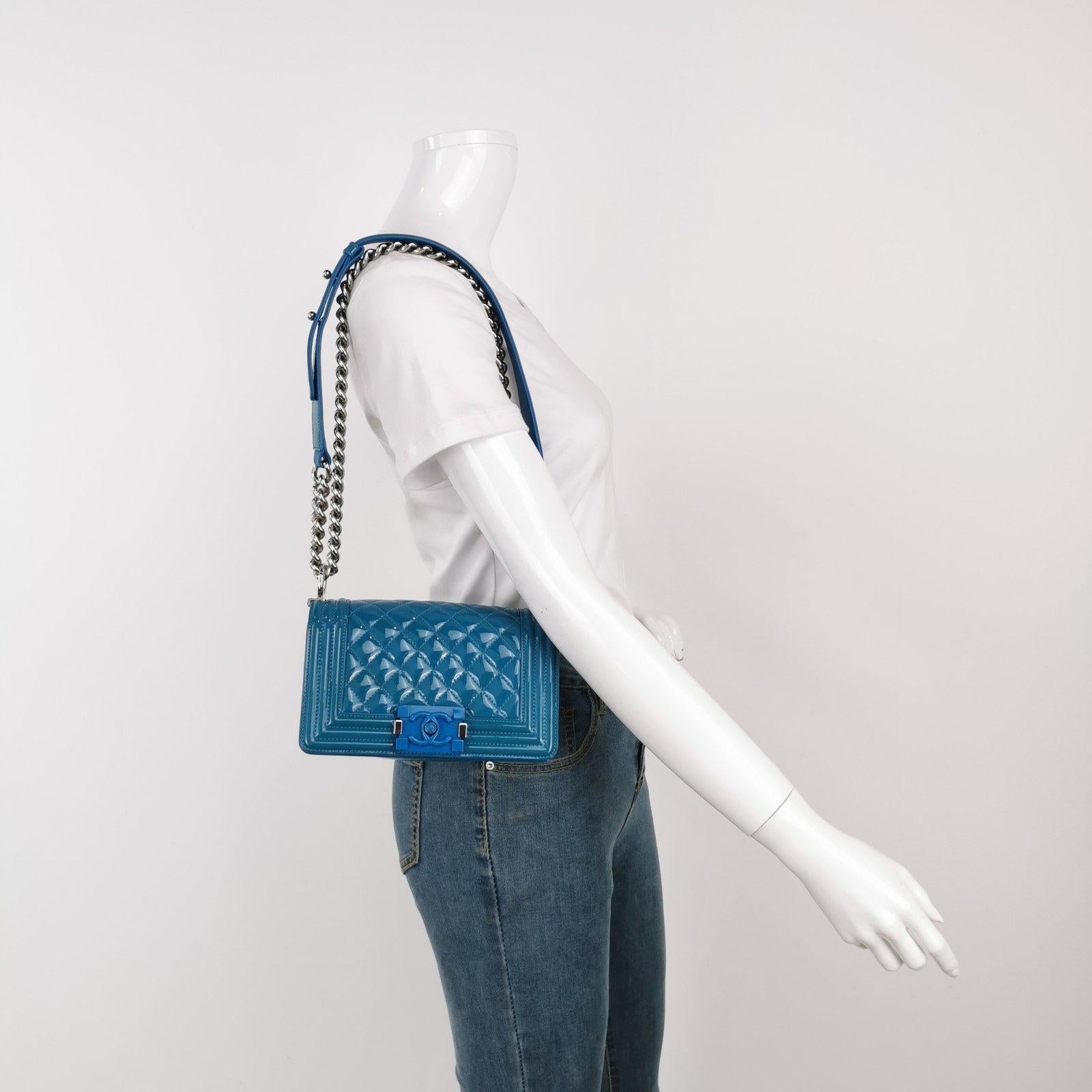 Chanel Le Boy 2014 Small Blue Patent Leather Bag These are professional photos of the actual bag offered by Luxbags. CONDITION: Very good condition with signs of use. This may include fading of material or plating. Scrapes on the leather around the
