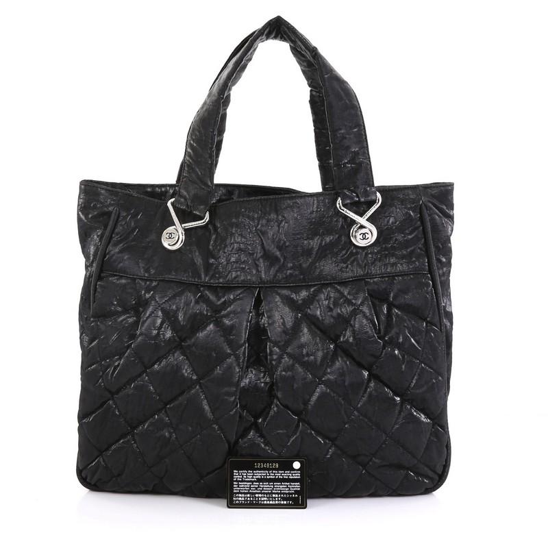 This Chanel Le Marais Tote Quilted Coated Canvas Large, crafted from black quilted coated canvas, features dual flat handles with 